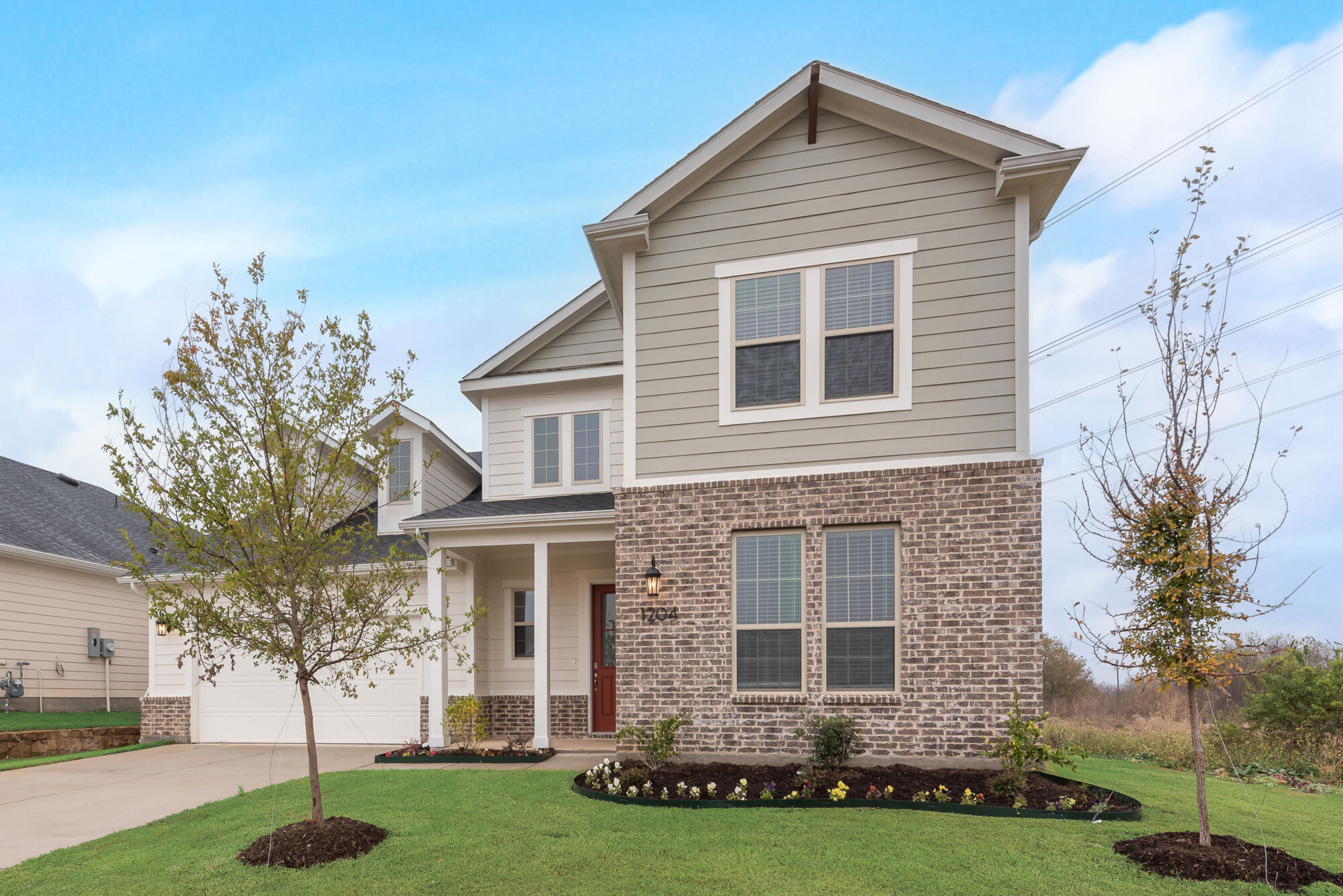 Elevation Front with window, exterior brick and exterior siding