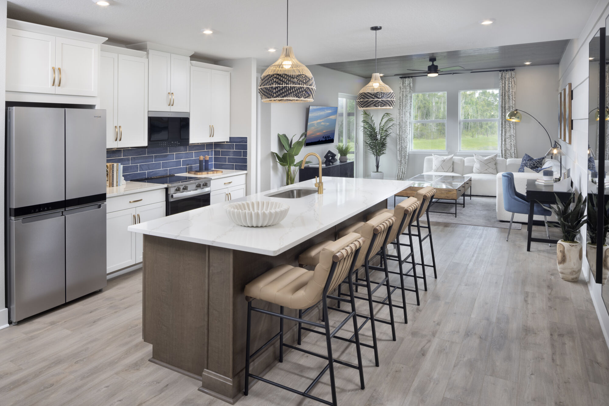 island, breakfast bar, stainless steel appliances, tile backsplash, LED can lights, barstools