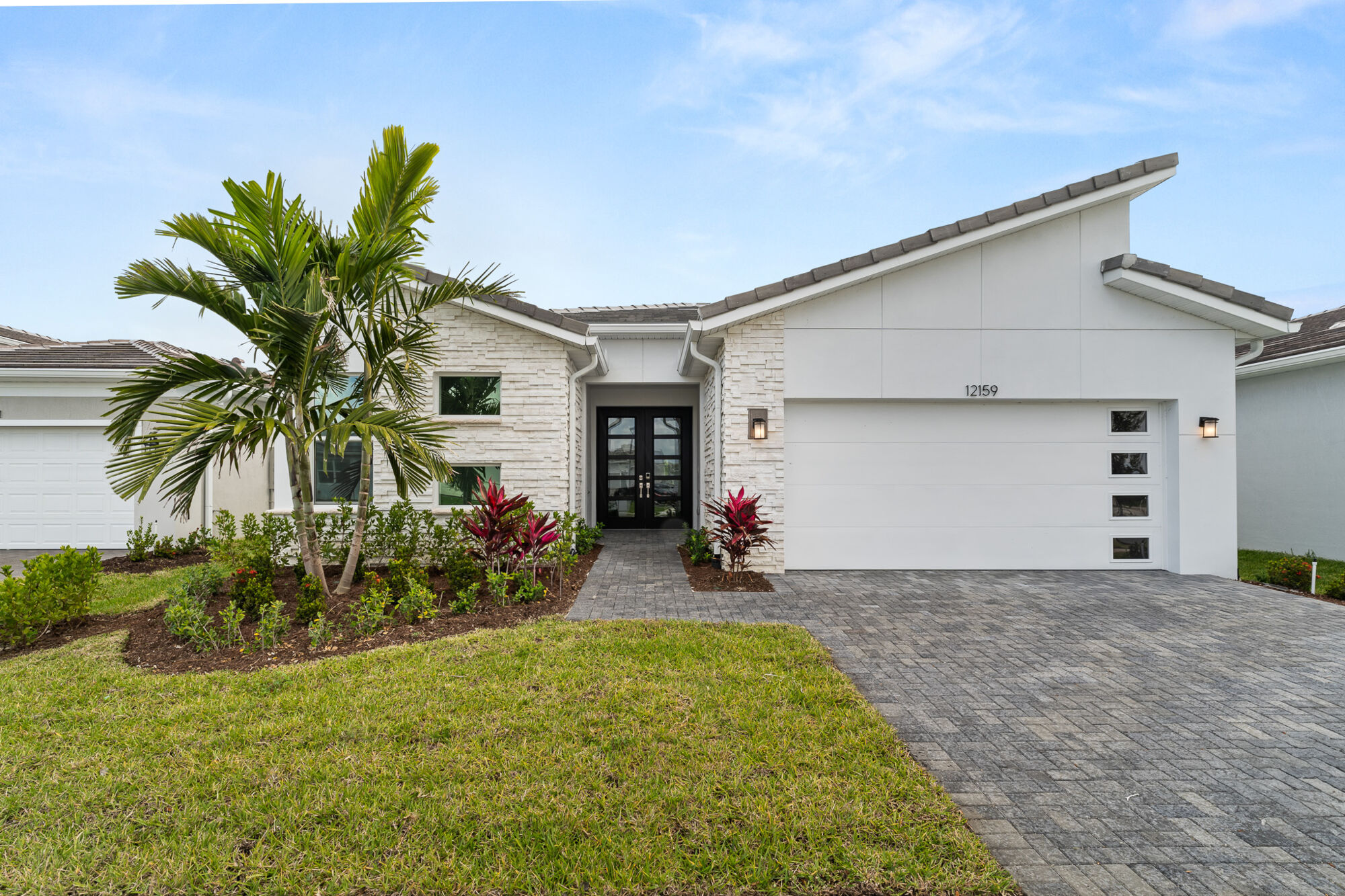  Elevation Front with garage, window, door and exterior stone