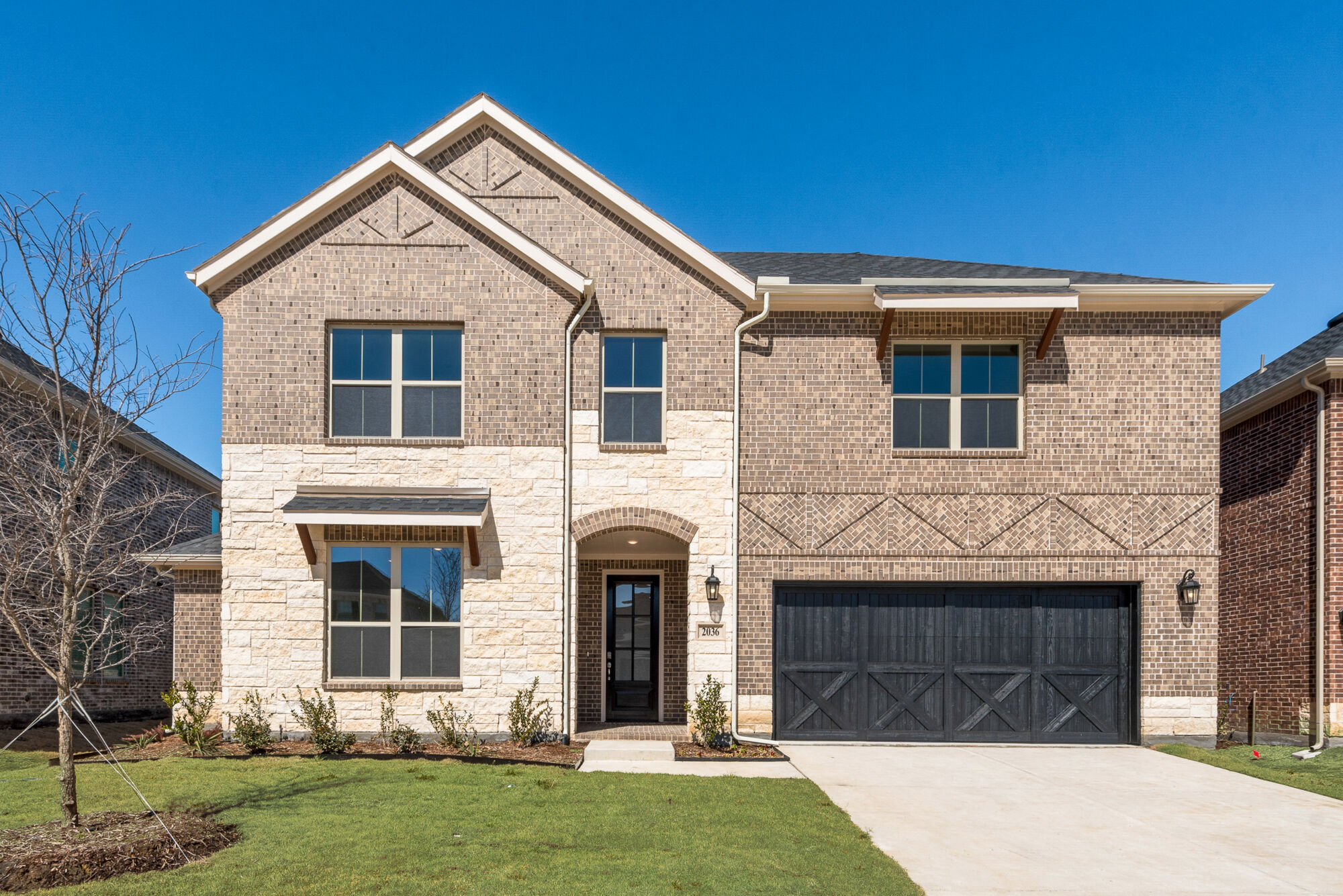Elevation Front with window, garage, door, exterior brick and exterior stone