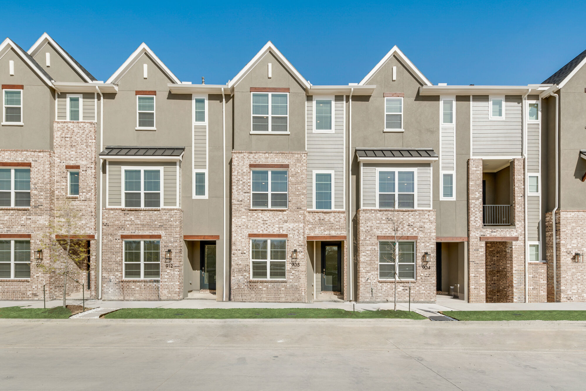 Town Homes with window, exterior brick, exterior stone and door