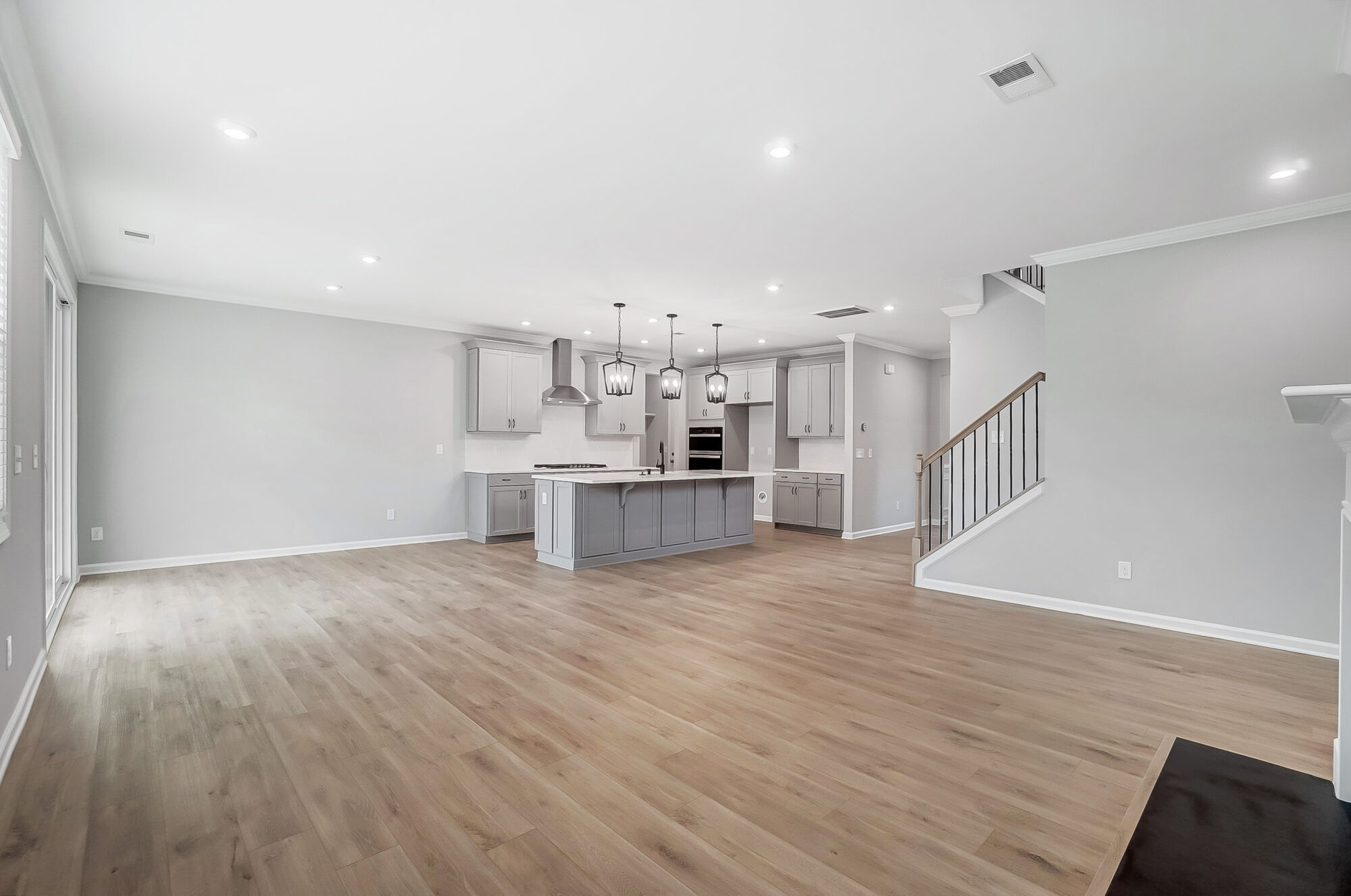 Great room with kitchen beyond