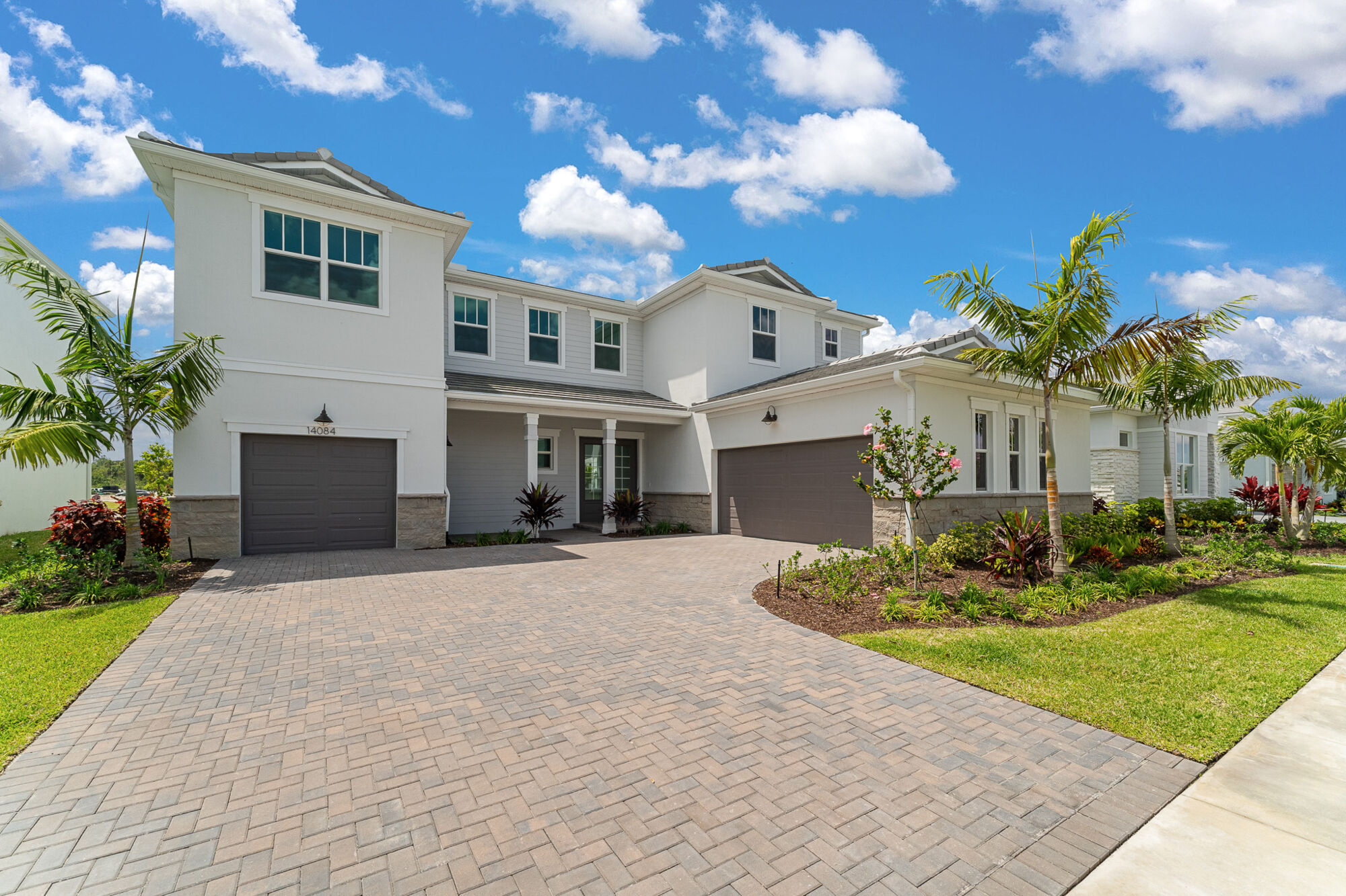  Elevation Front with window, garage, door and stone flooring