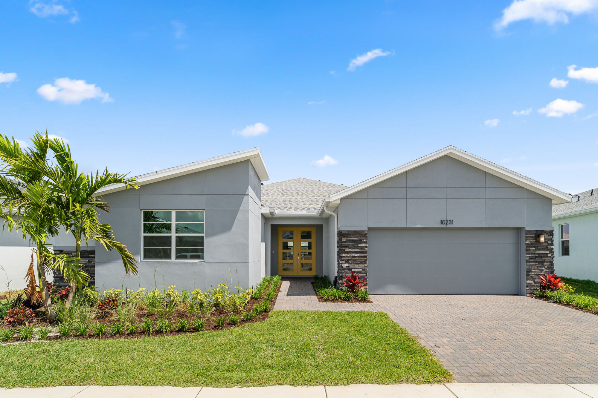  Elevation Front with garage, window and exterior stone