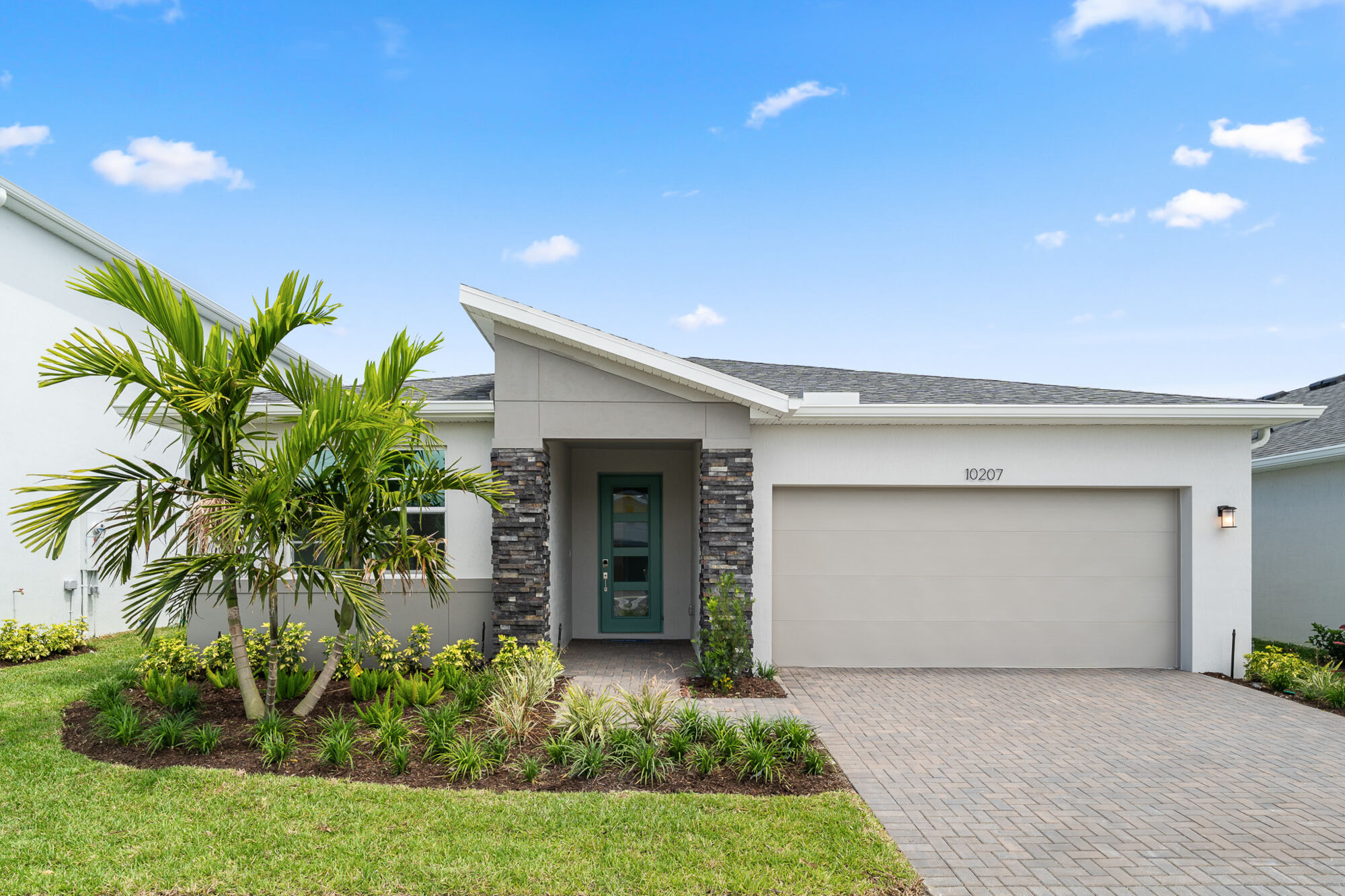  Elevation Front with garage, door and exterior stone