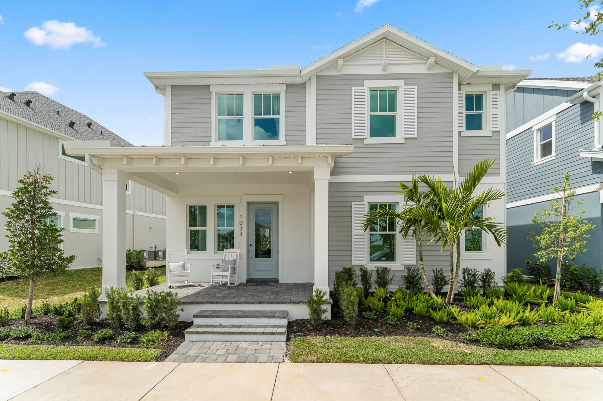 Exterior of two story home with full front porch
