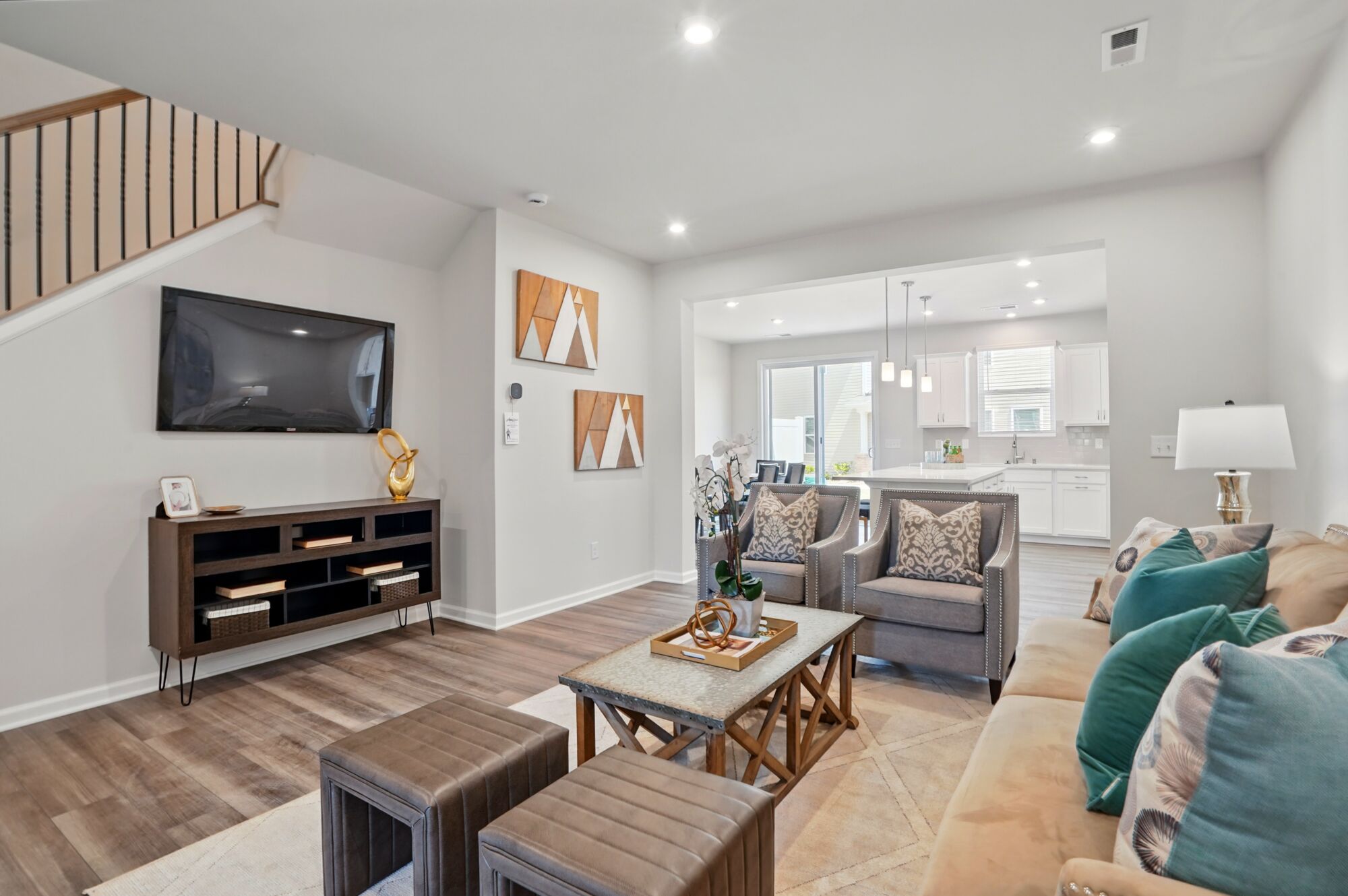 Gathering room with kitchen beyond