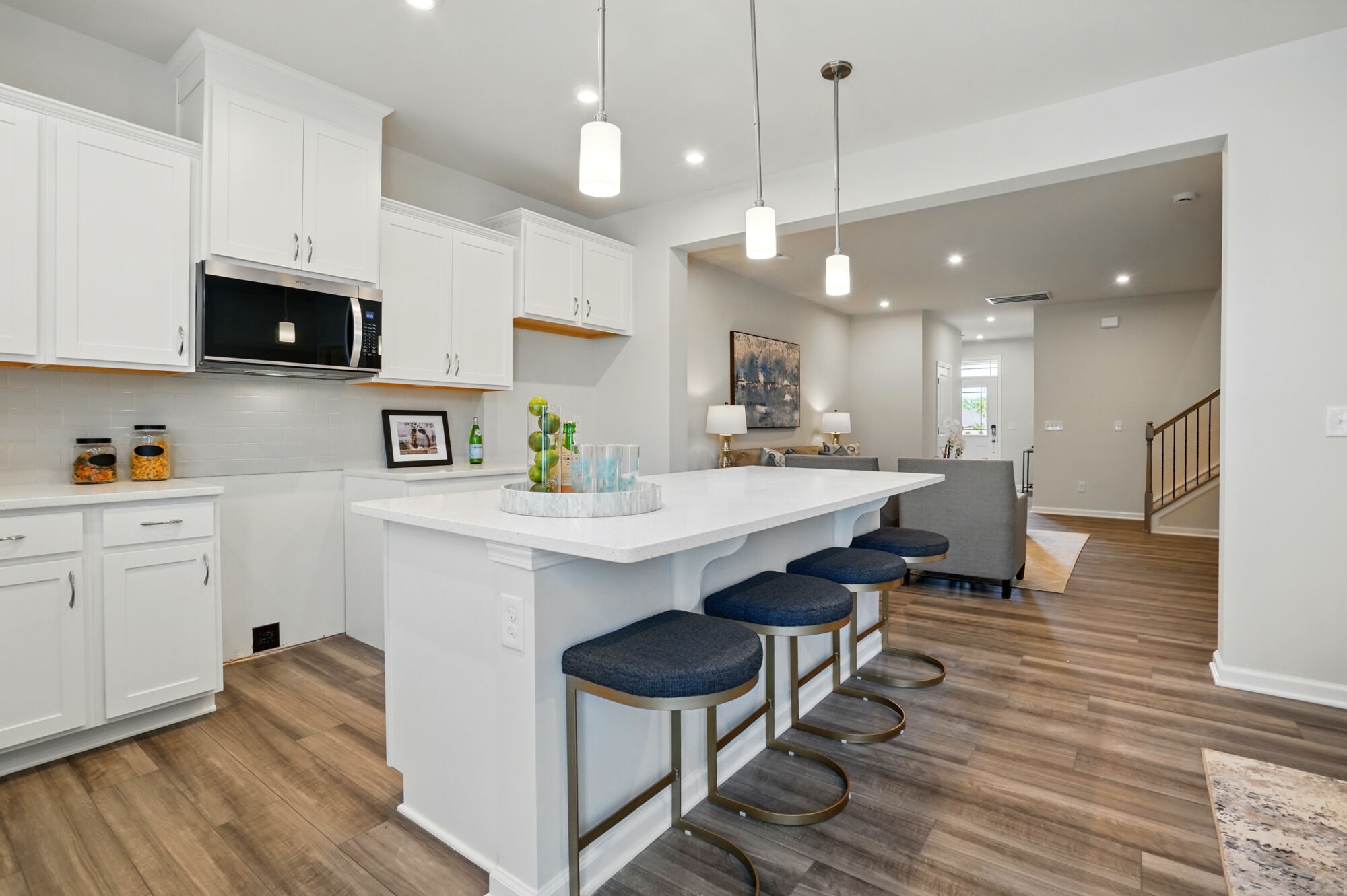 Kitchen with gathering room beyond