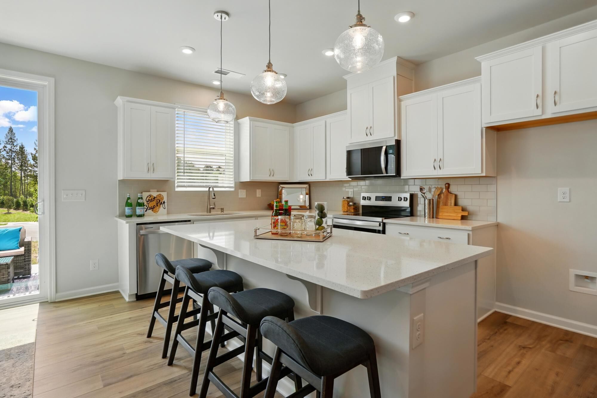 Kitchen with island breakfast bar