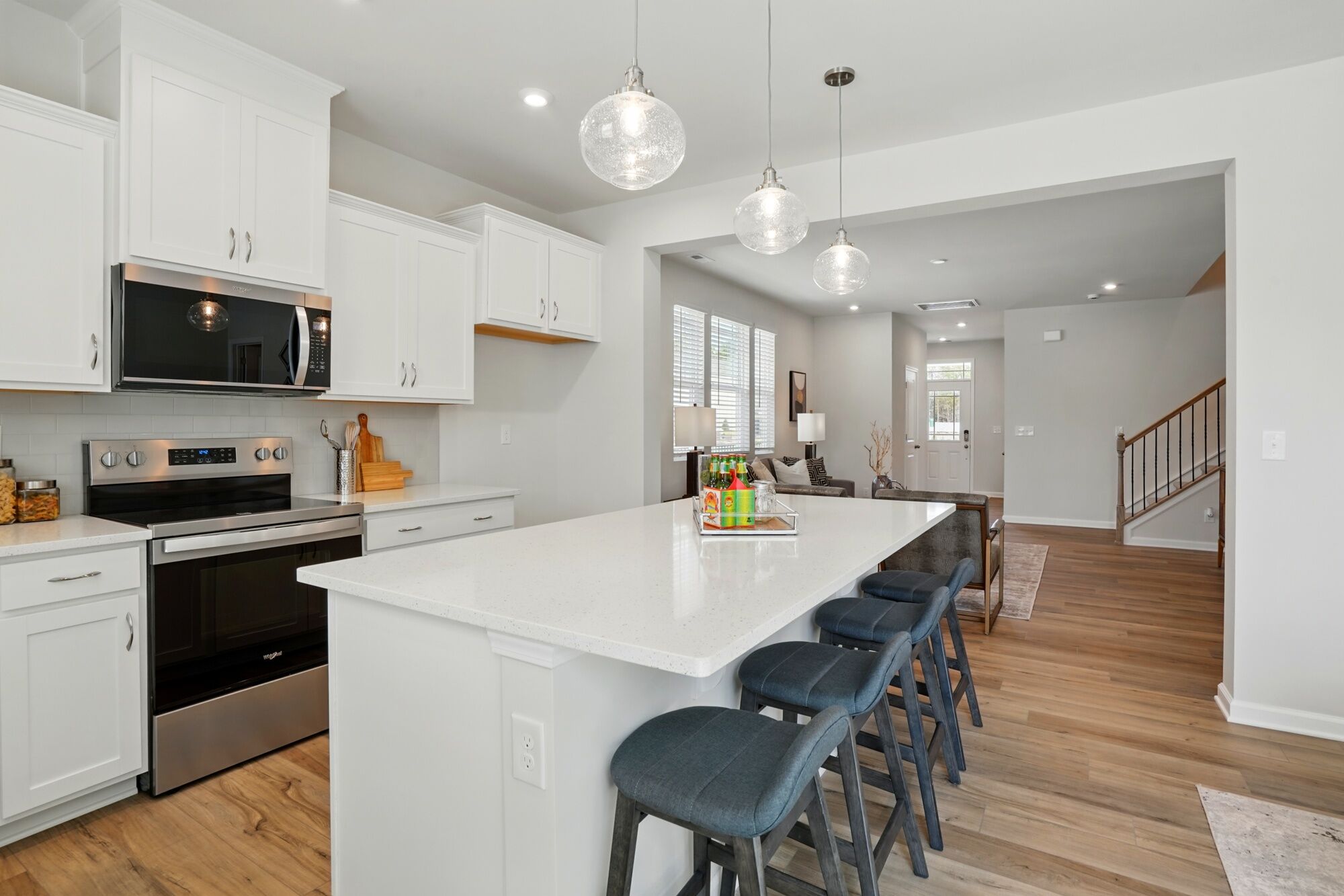 Kitchen with gathering room beyond