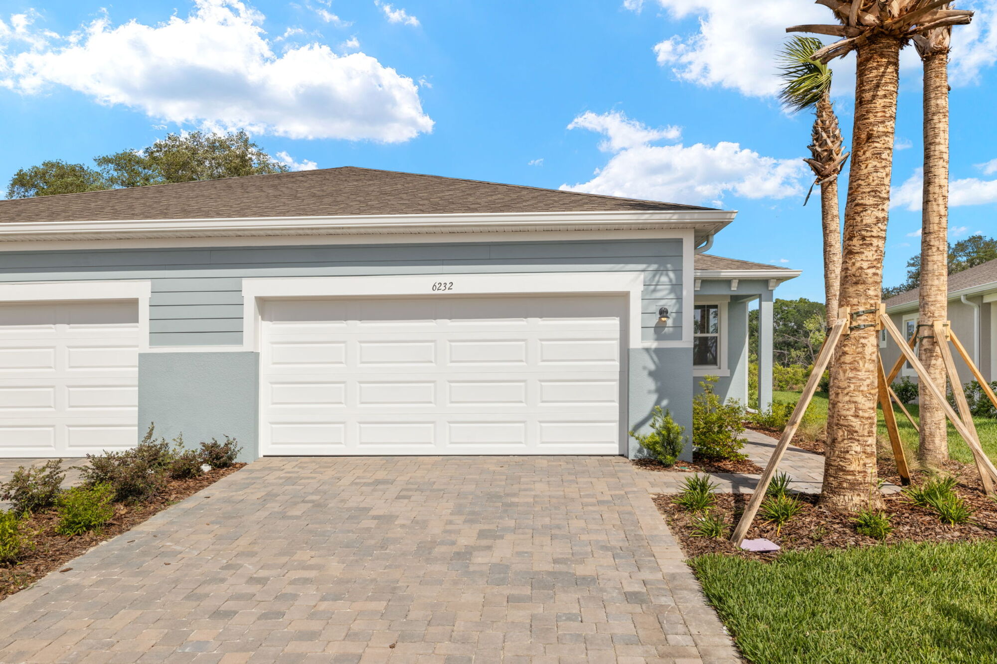  Garage with window, stone flooring and tile flooring