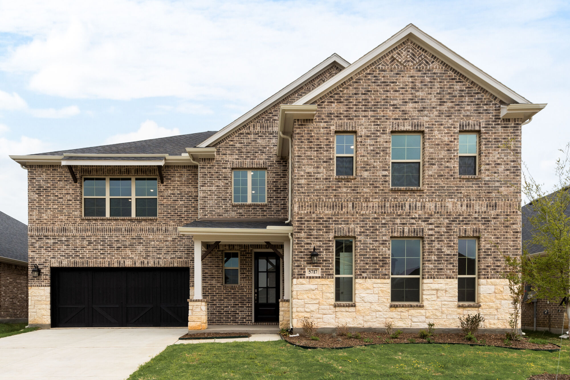Elevation Front with window, garage, door, exterior brick and exterior stone