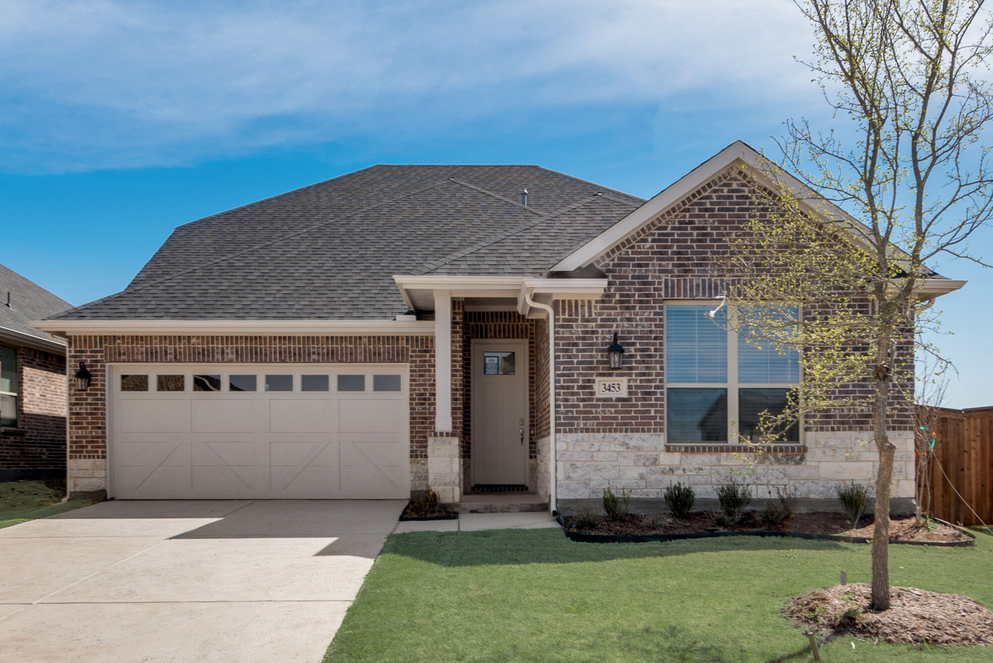 Elevation Front with window, garage, exterior brick, door and exterior stone