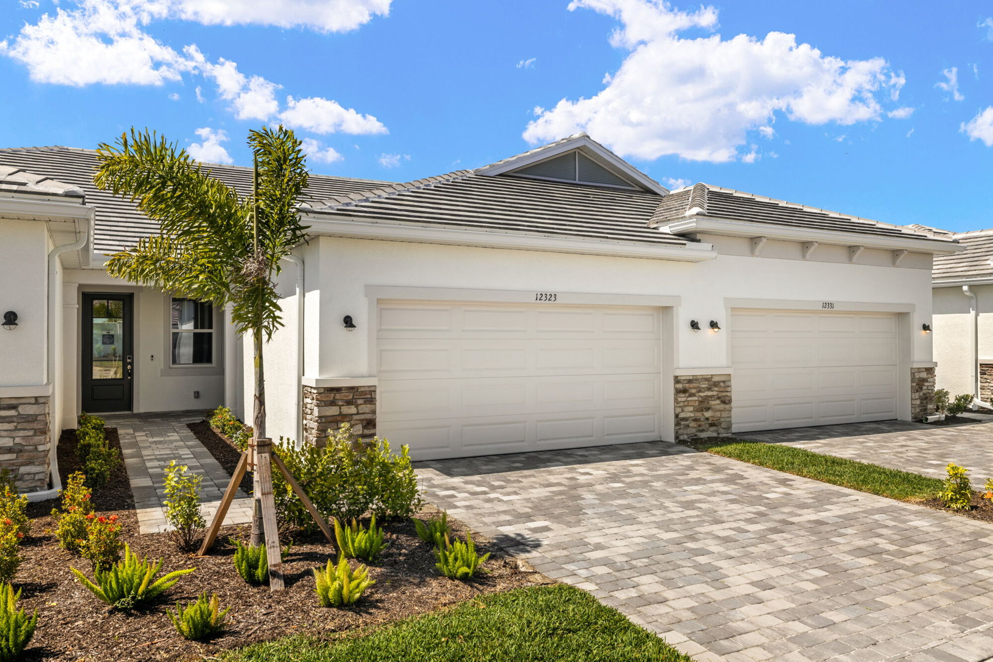  Elevation Front with garage, window and exterior stone