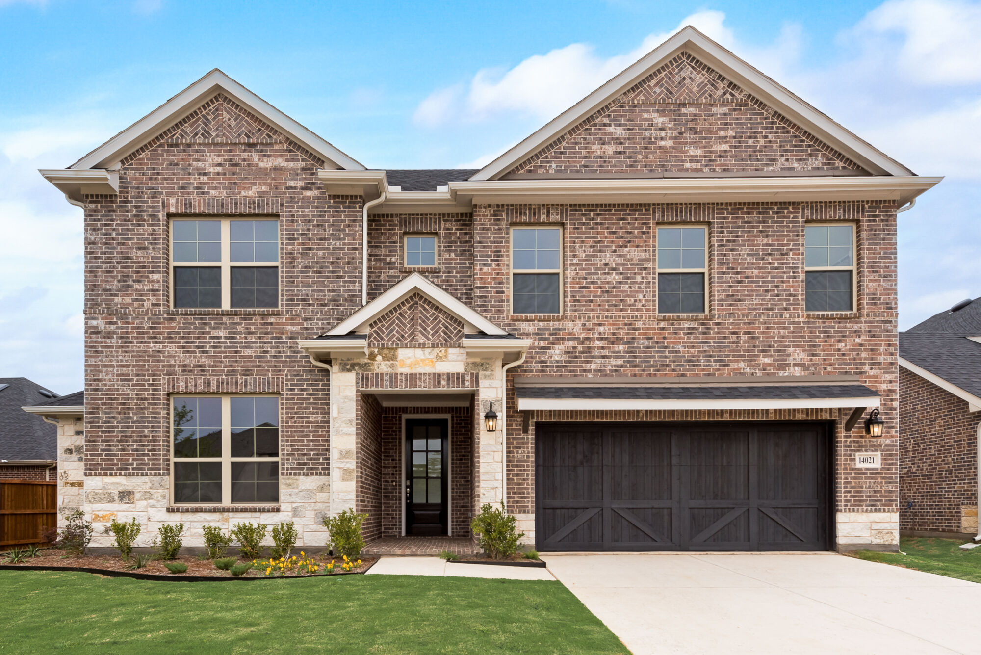 Elevation Front with window, garage, door and exterior brick