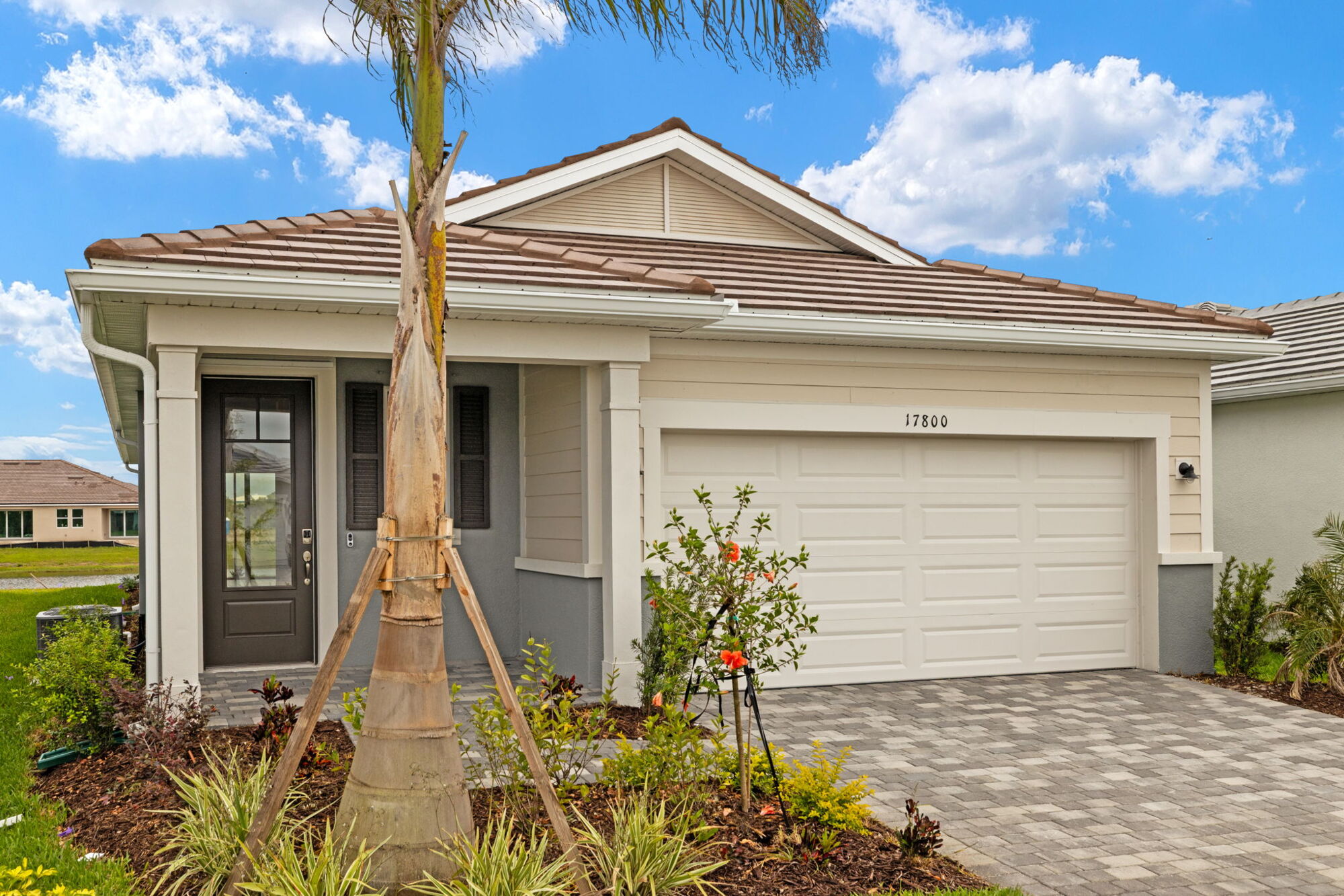  Elevation Front with garage, window, door and exterior clapboard