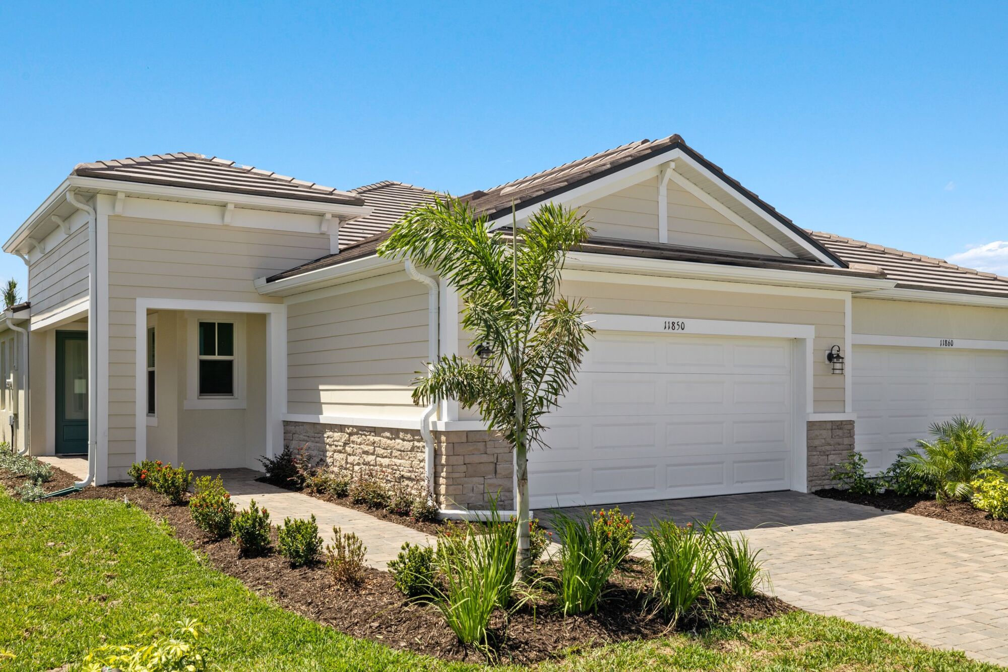 paired villa, study, washer and dryer, open kitchen, dining and great room, glass sliders. screened, covered lanai, stainless steel appliances, shaker cabinets, light countertops, walk-in closet, glass enclosed shower