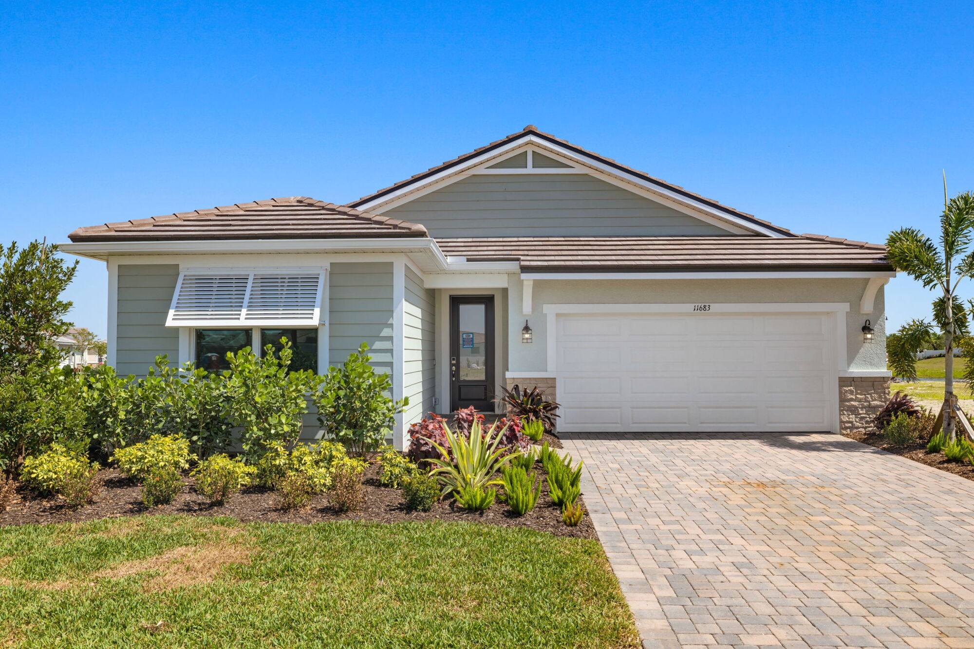  Elevation Front with door, garage, window and exterior clapboard