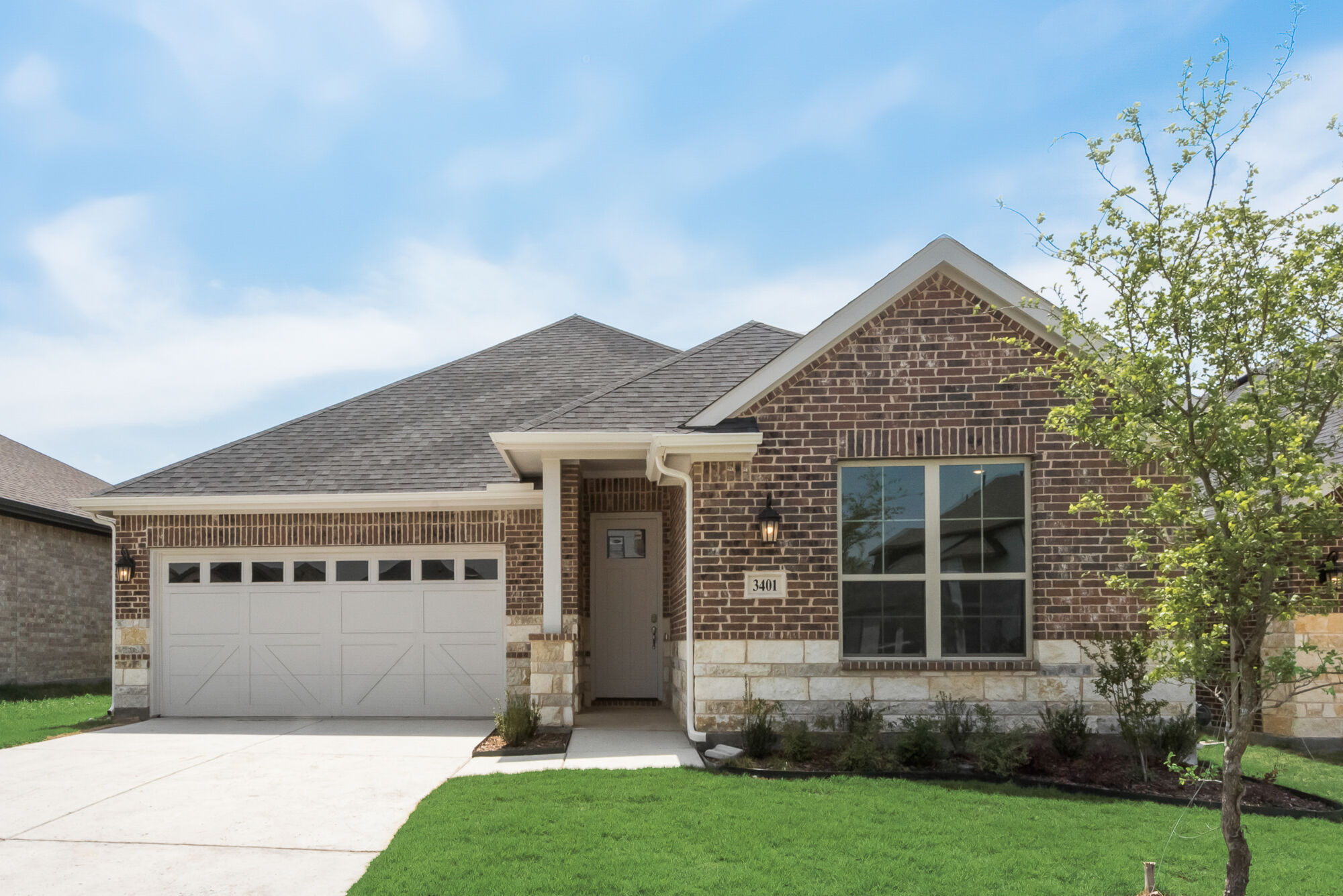 Elevation Front with garage, window, door, exterior brick and exterior stone