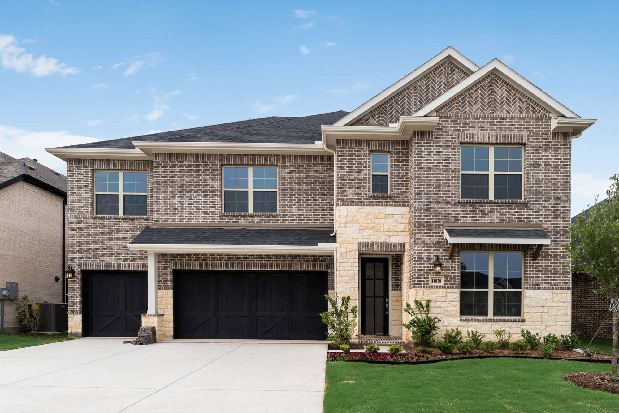 Elevation Front with window, garage, door, exterior brick and exterior stone