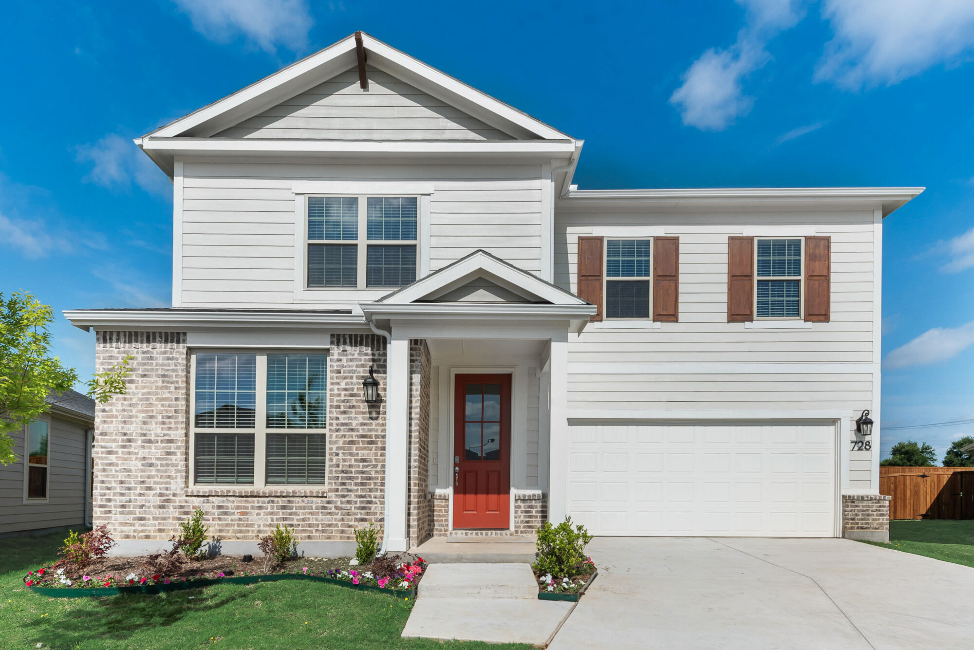 Elevation Front with window, garage and door