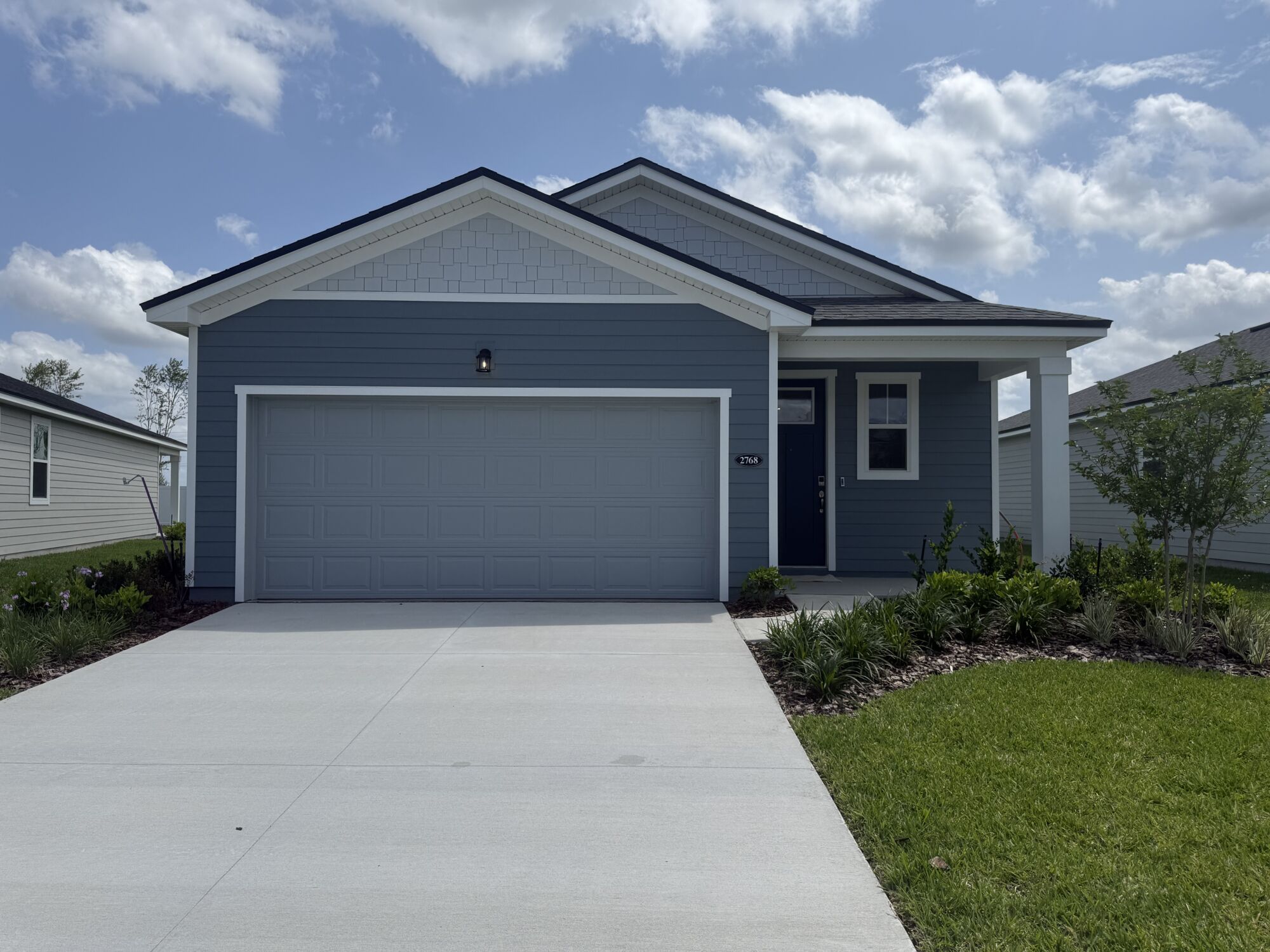 Blue house with blue garage