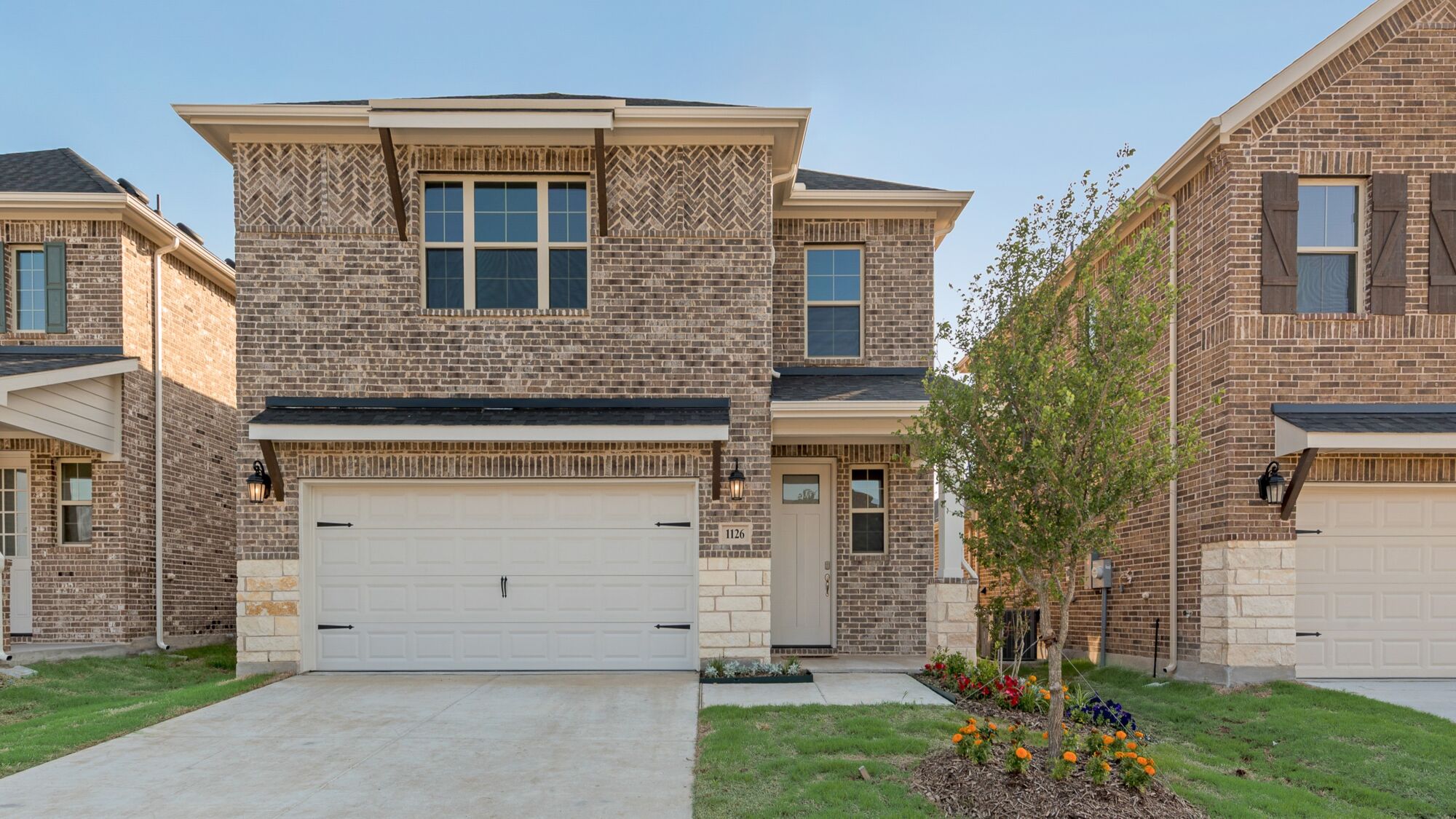 Elevation Front with window, garage, exterior brick, door and exterior stone