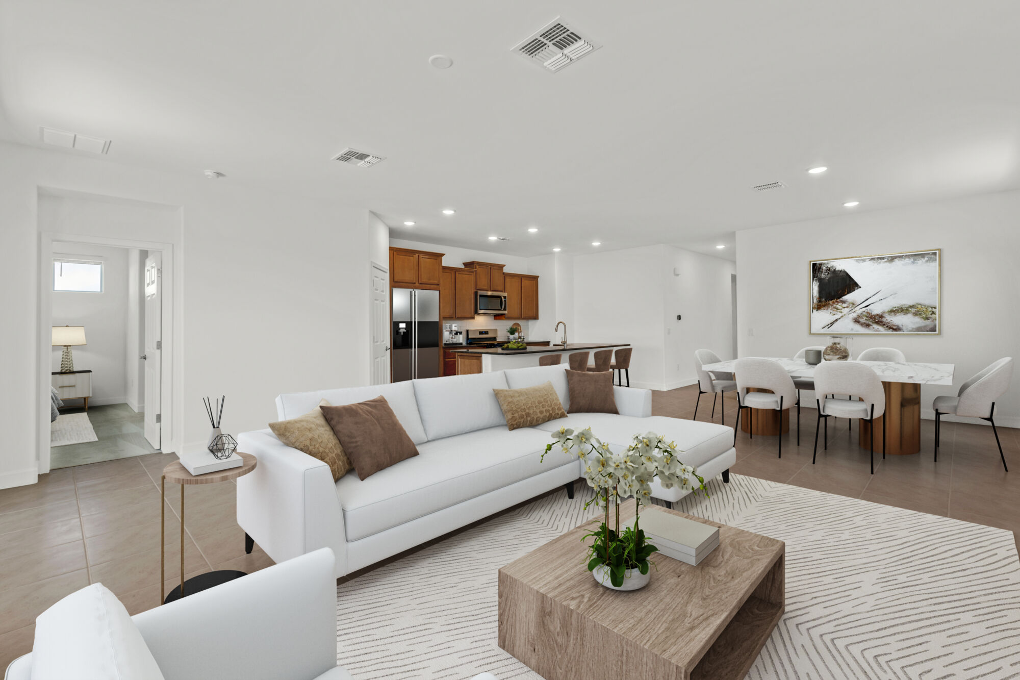 Greatroom with painting, refrigerator, rug, window and light wood cabinets