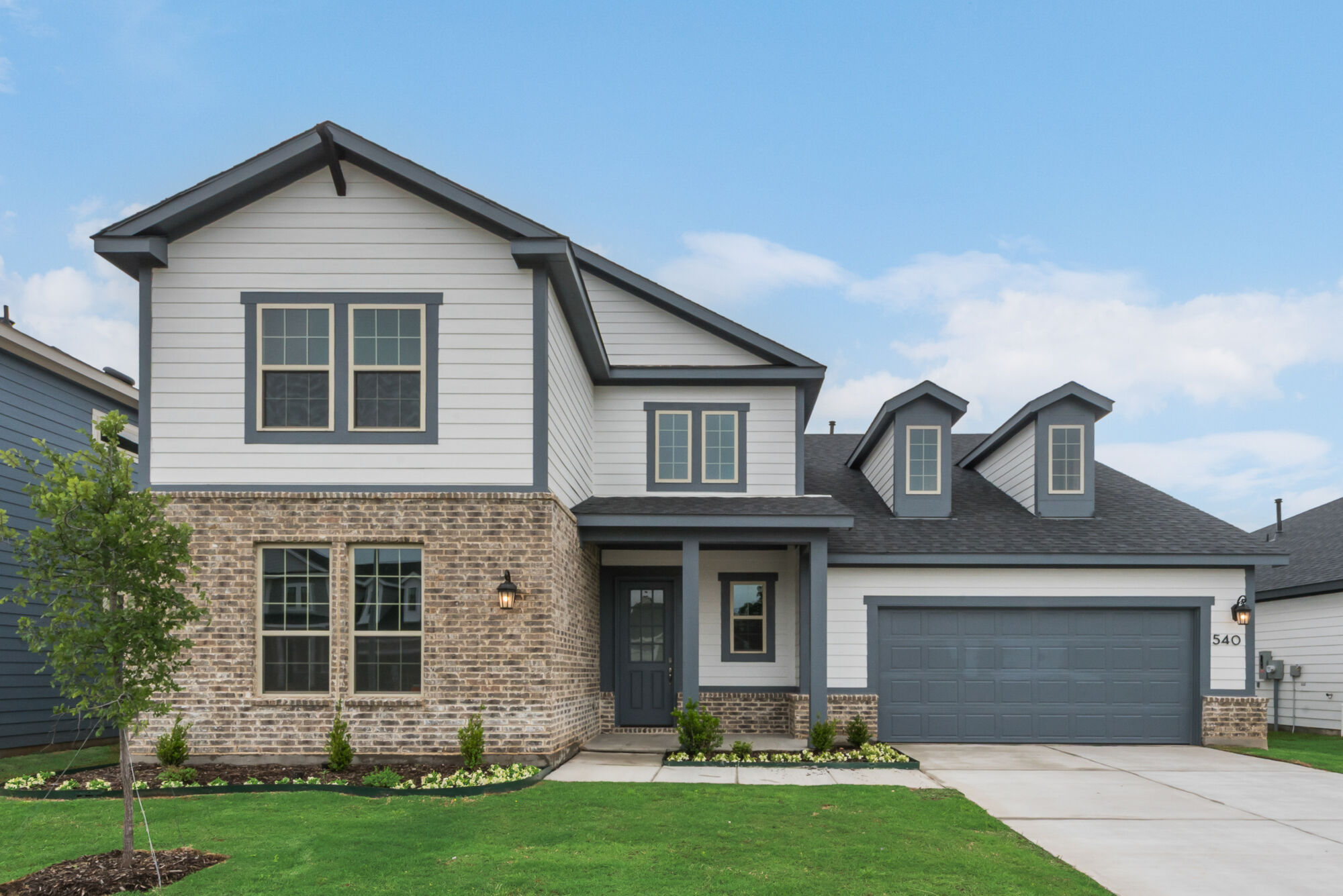 Elevation Front with garage, window, exterior brick, exterior clapboard and door