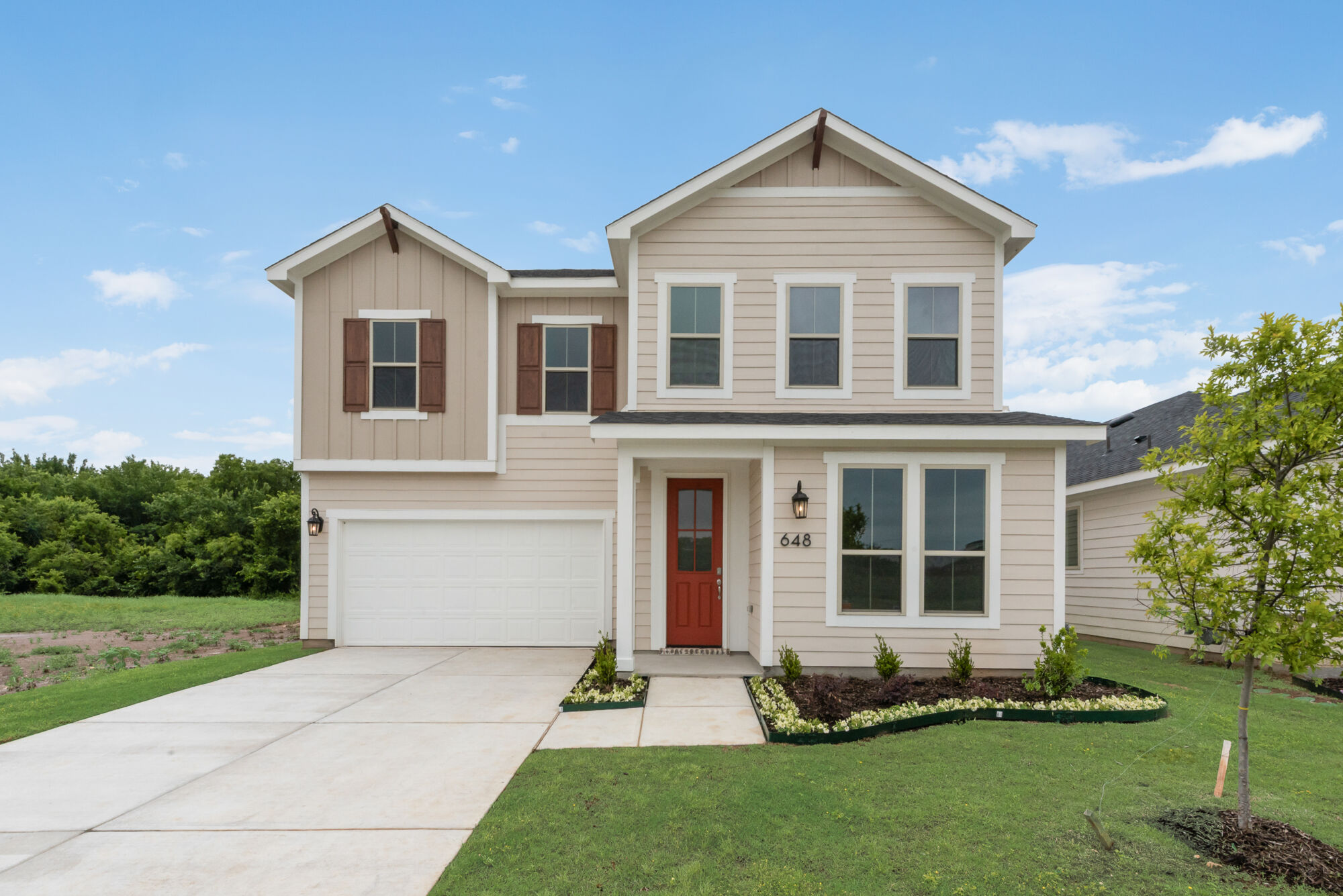 Elevation Front with window, garage, door and exterior clapboard