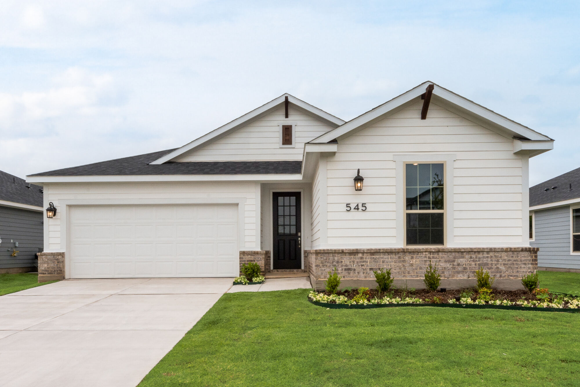 Elevation Front with window, garage, door and exterior clapboard