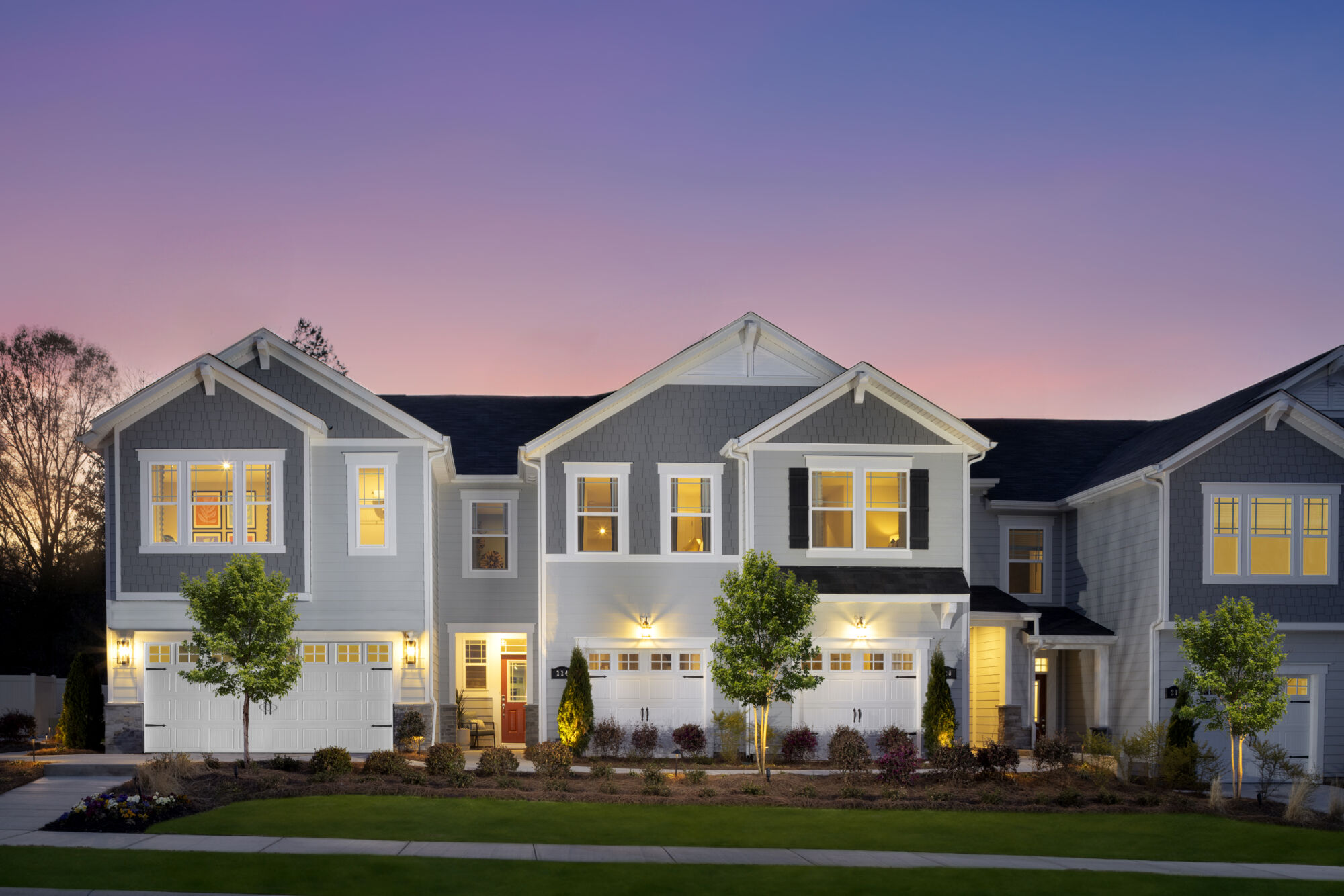 2-story townhome exteriors at twilgiht
