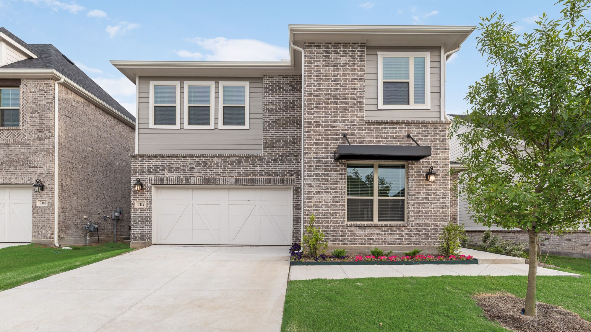 Elevation Front with garage, window, exterior clapboard and exterior brick