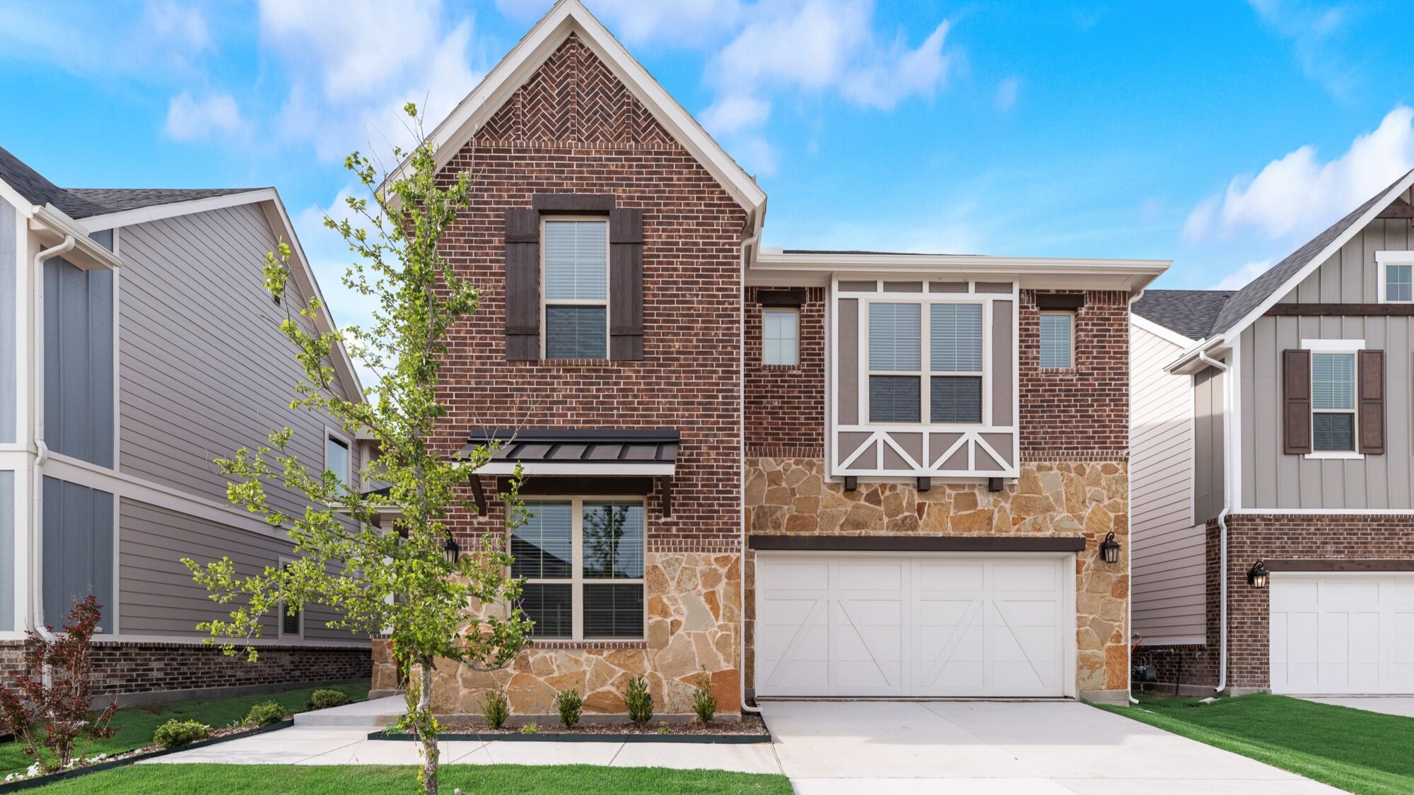 Elevation Front with window, garage, exterior brick and exterior clapboard