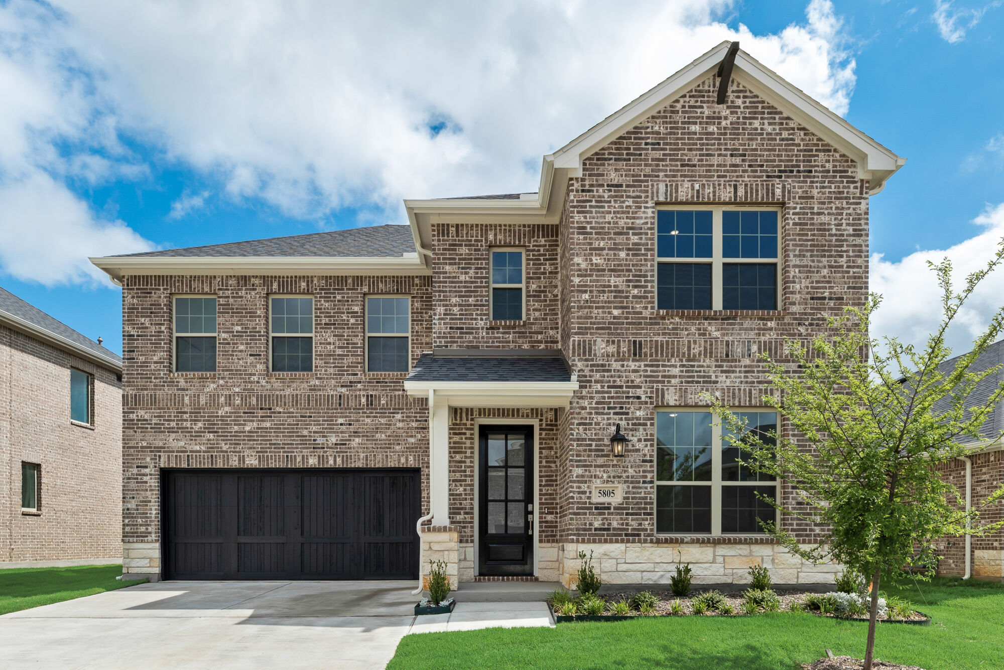 Elevation Front with garage, window, door, exterior brick and exterior stone