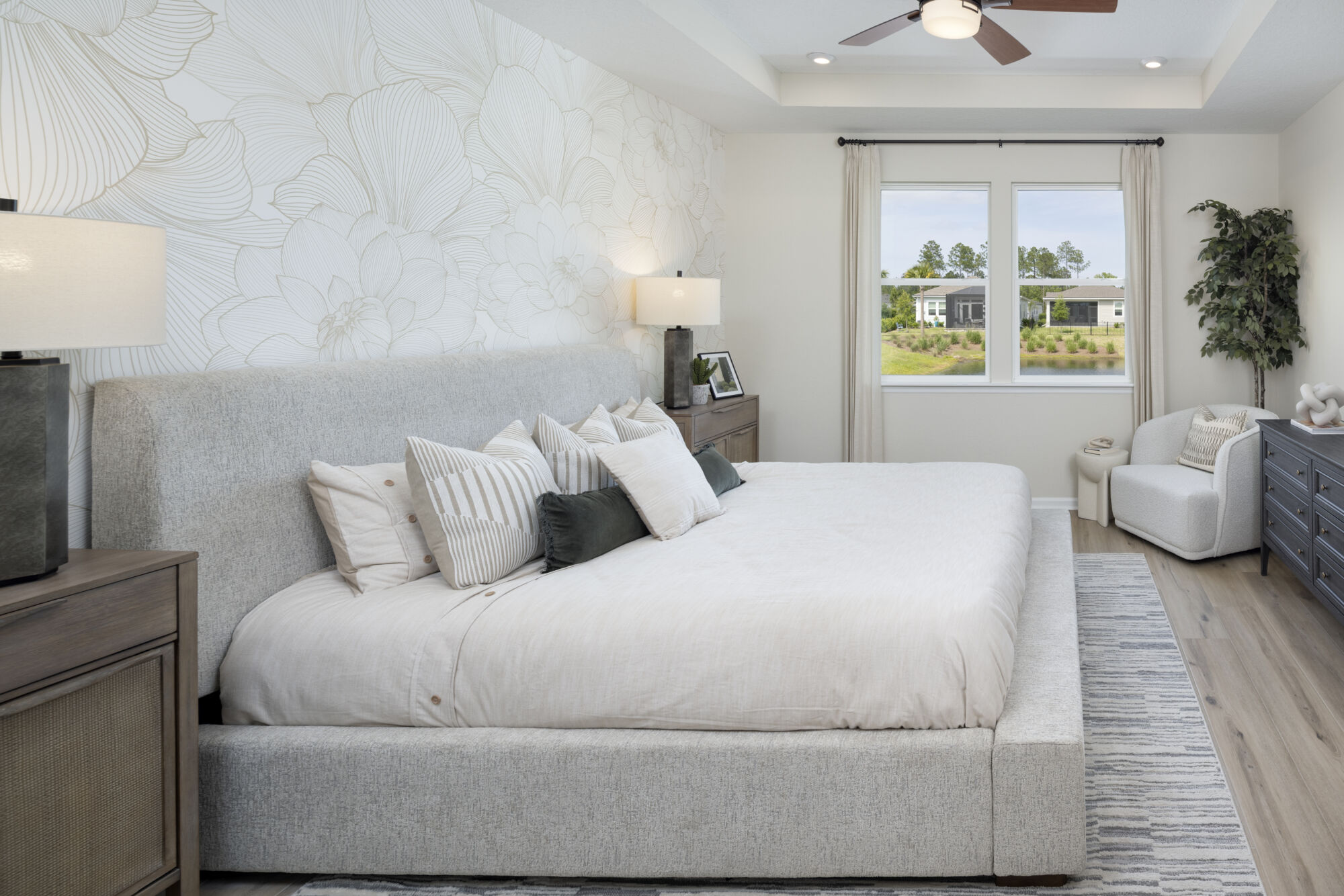 Owners Suite Bedroom with window and curtains