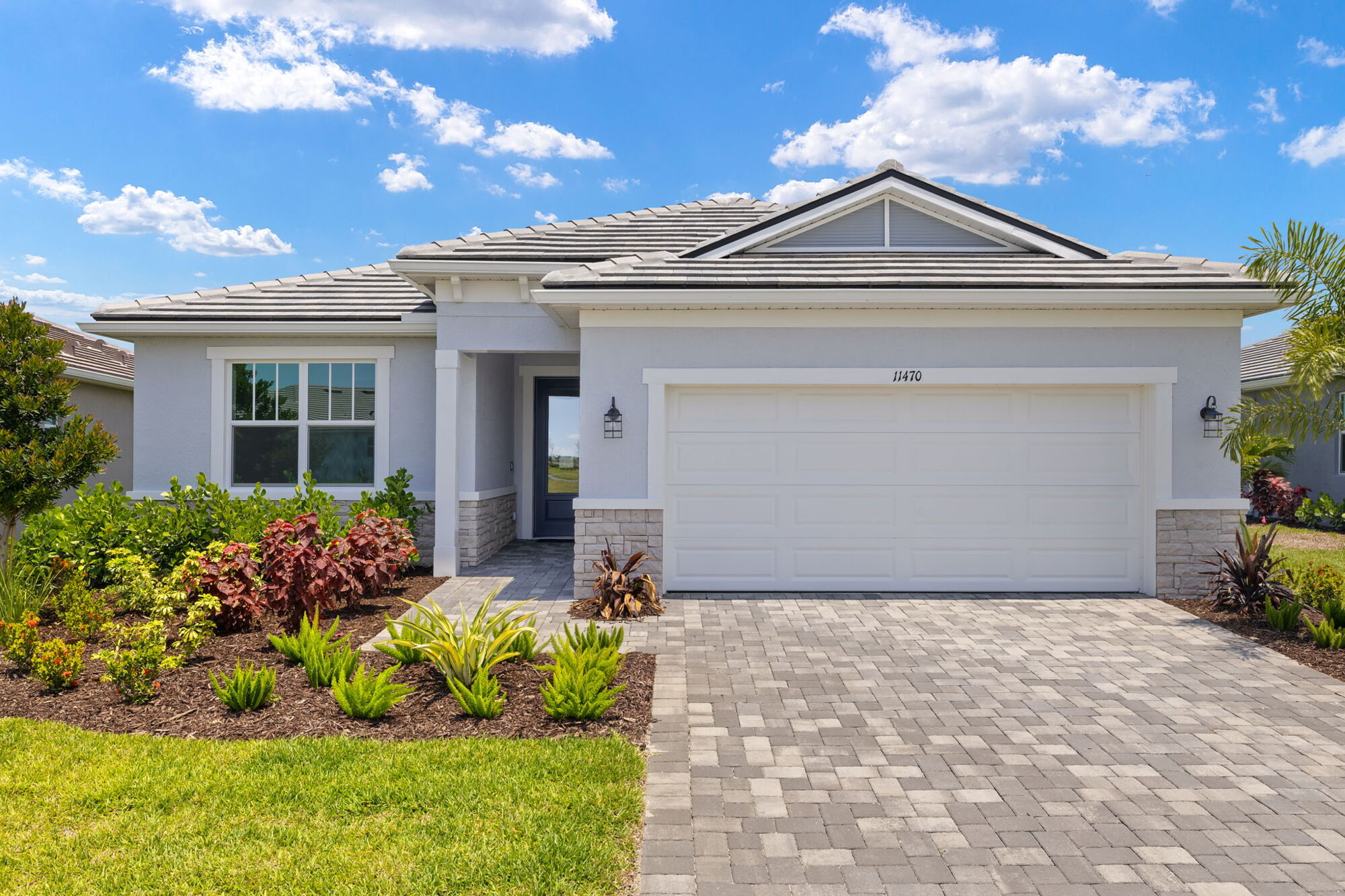  Elevation Front with garage, window, exterior stone and door