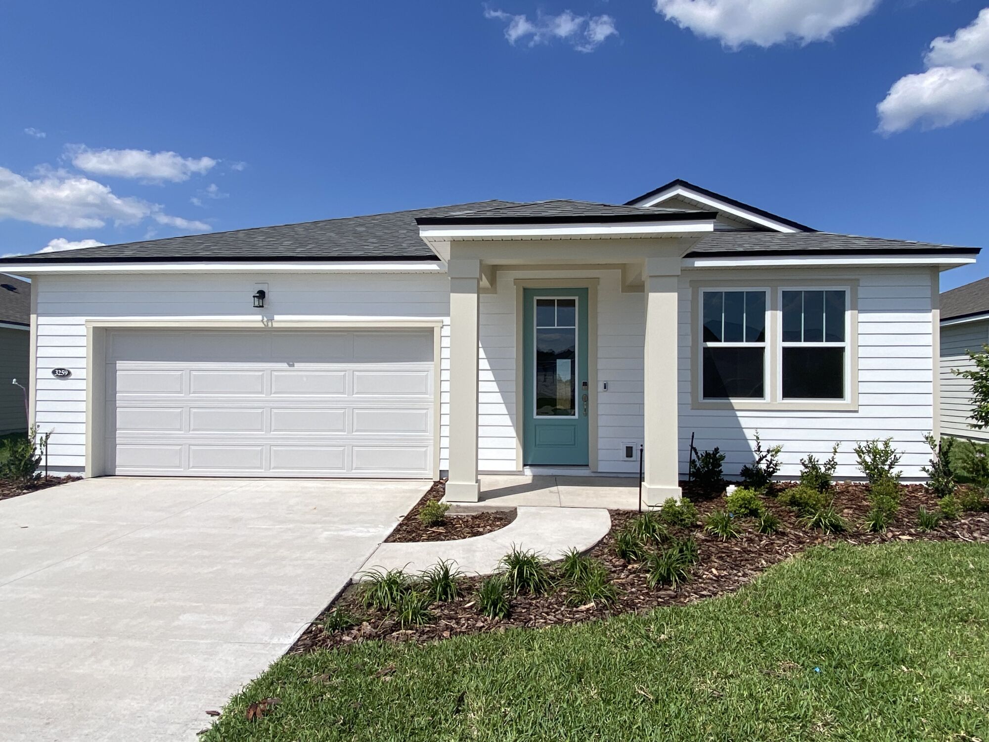  Elevation Front with garage, door, window and exterior clapboard