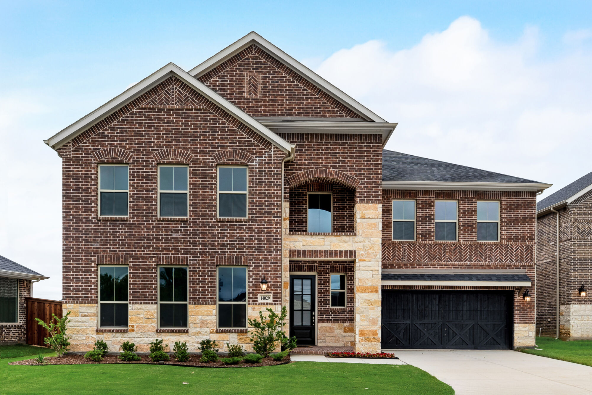 Elevation Front with window, garage, door, exterior brick and exterior stone