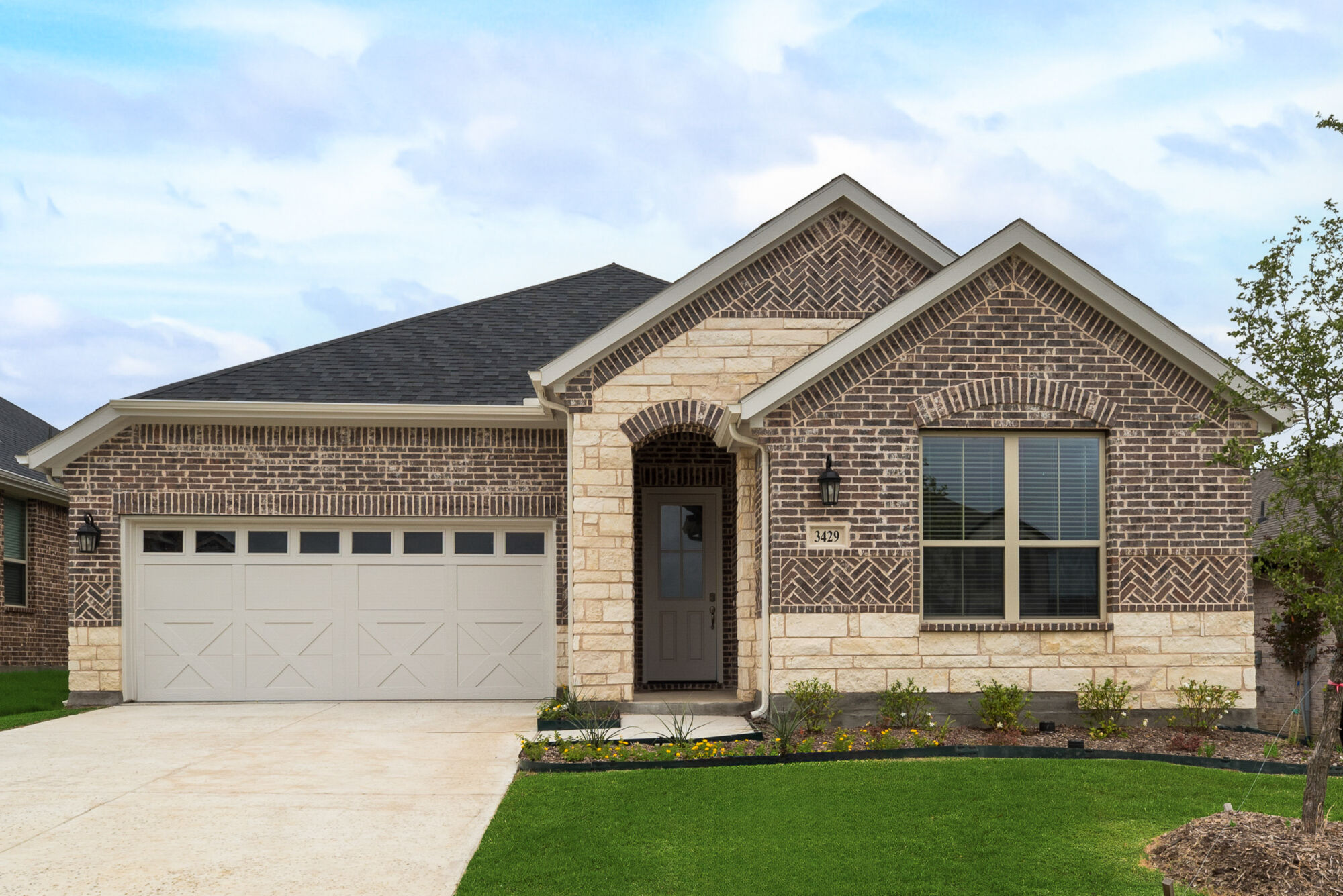 Elevation Front with garage, window, door, exterior brick and exterior stone