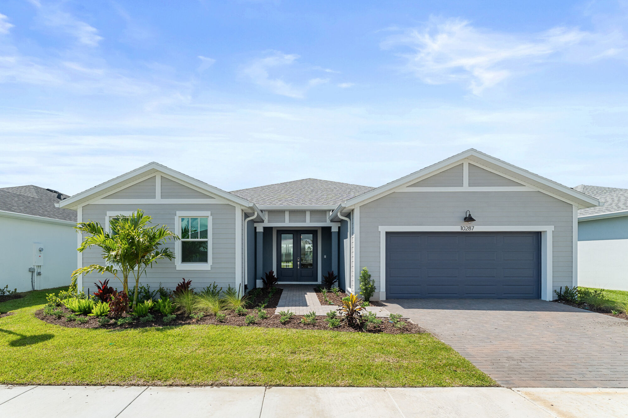  Elevation Front with garage, window, door and exterior clapboard