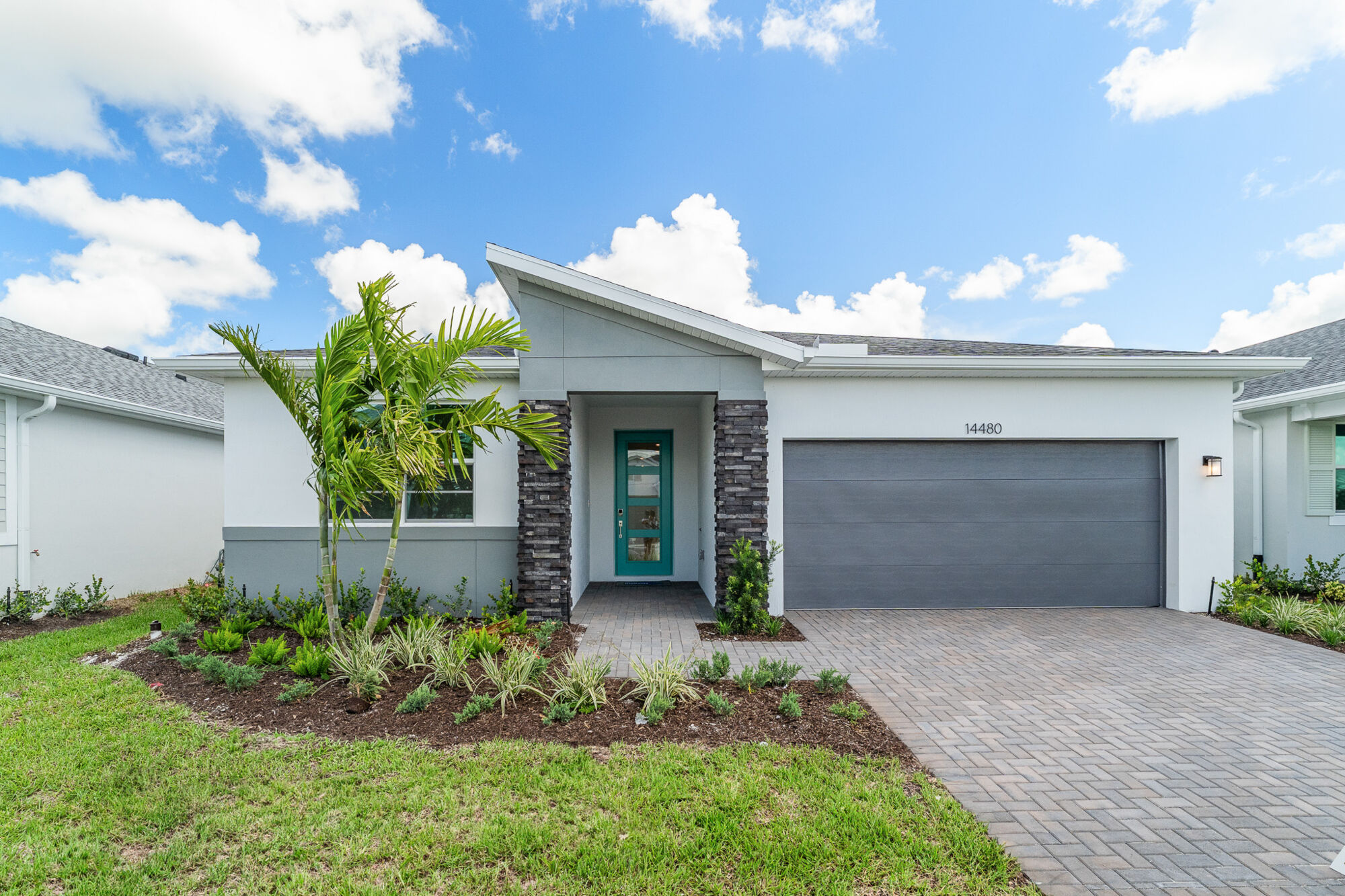  Elevation Front with garage, door and exterior stone