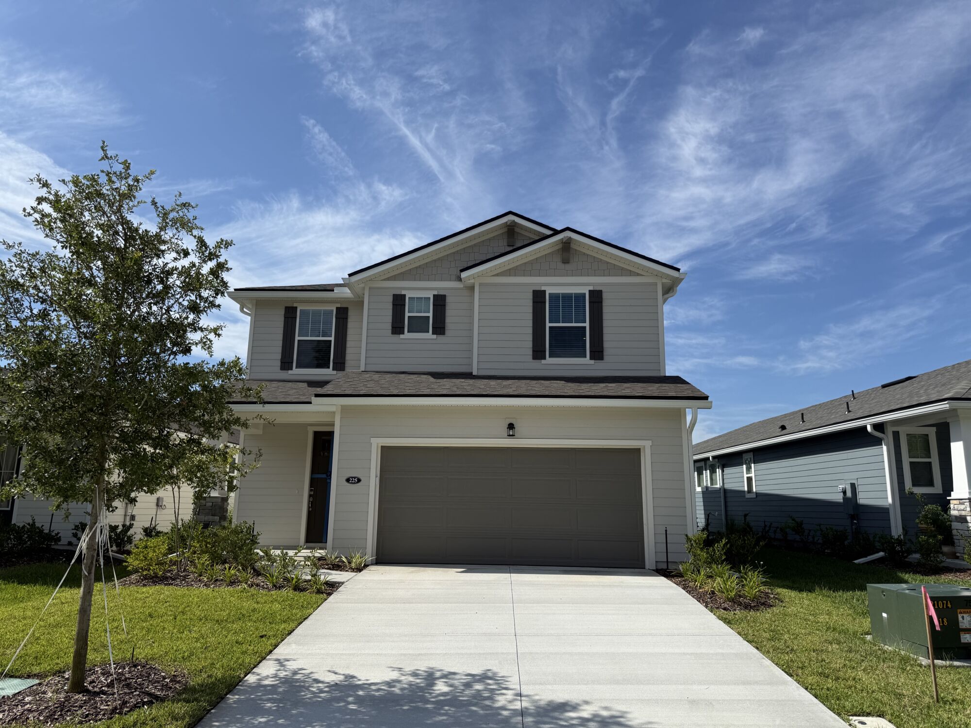  Elevation Front with window, garage, door and exterior clapboard