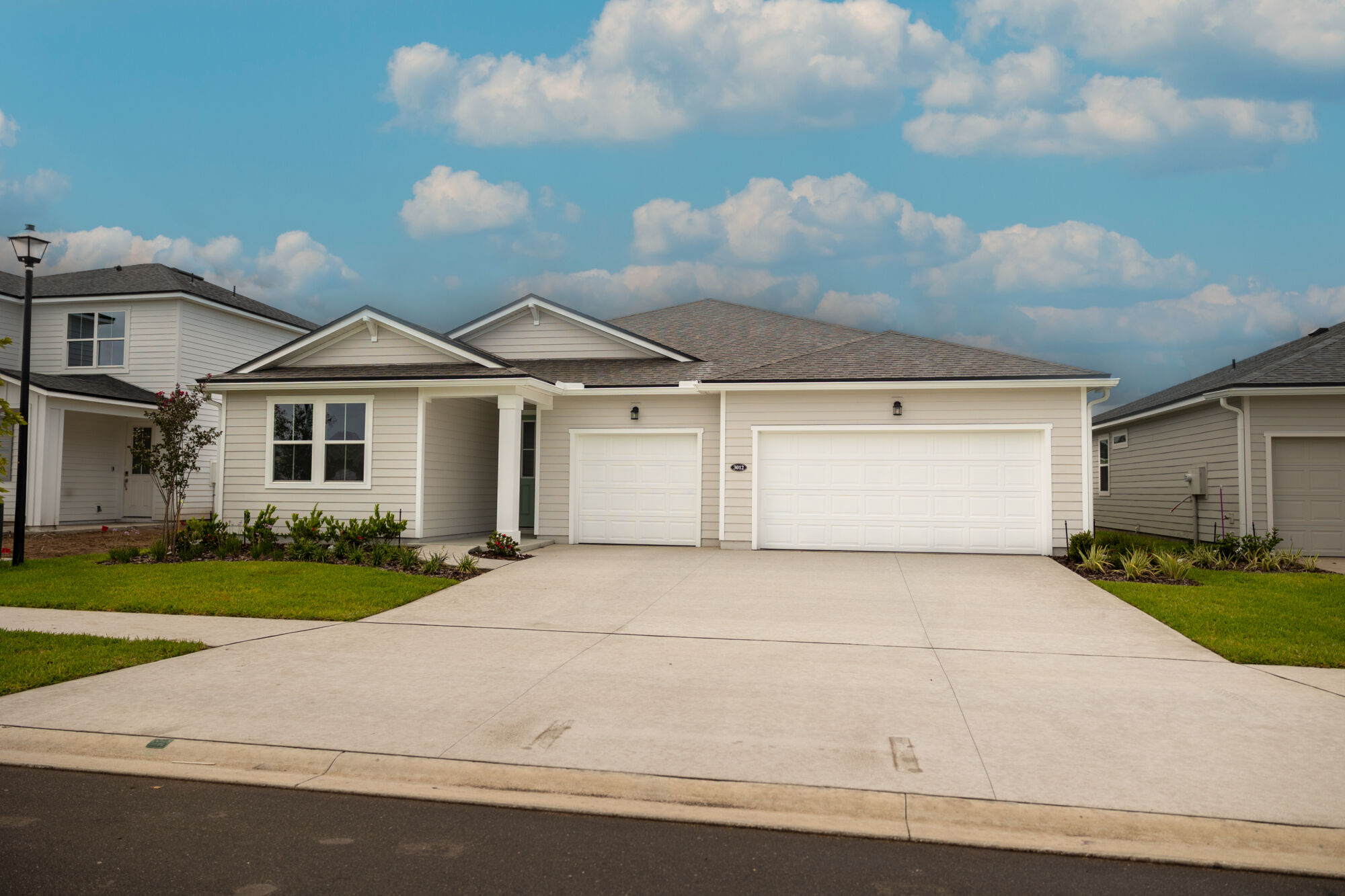  Elevation Front with garage, window and exterior clapboard