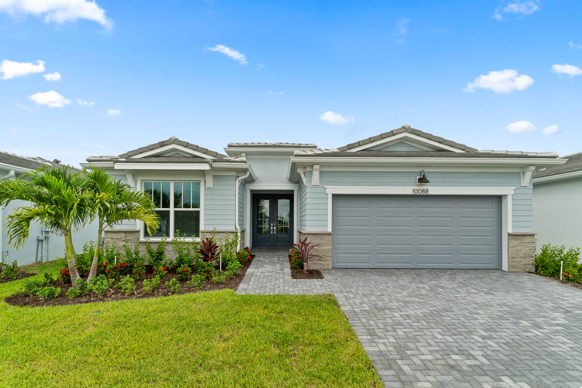  Elevation Front with garage, door, window and exterior stone