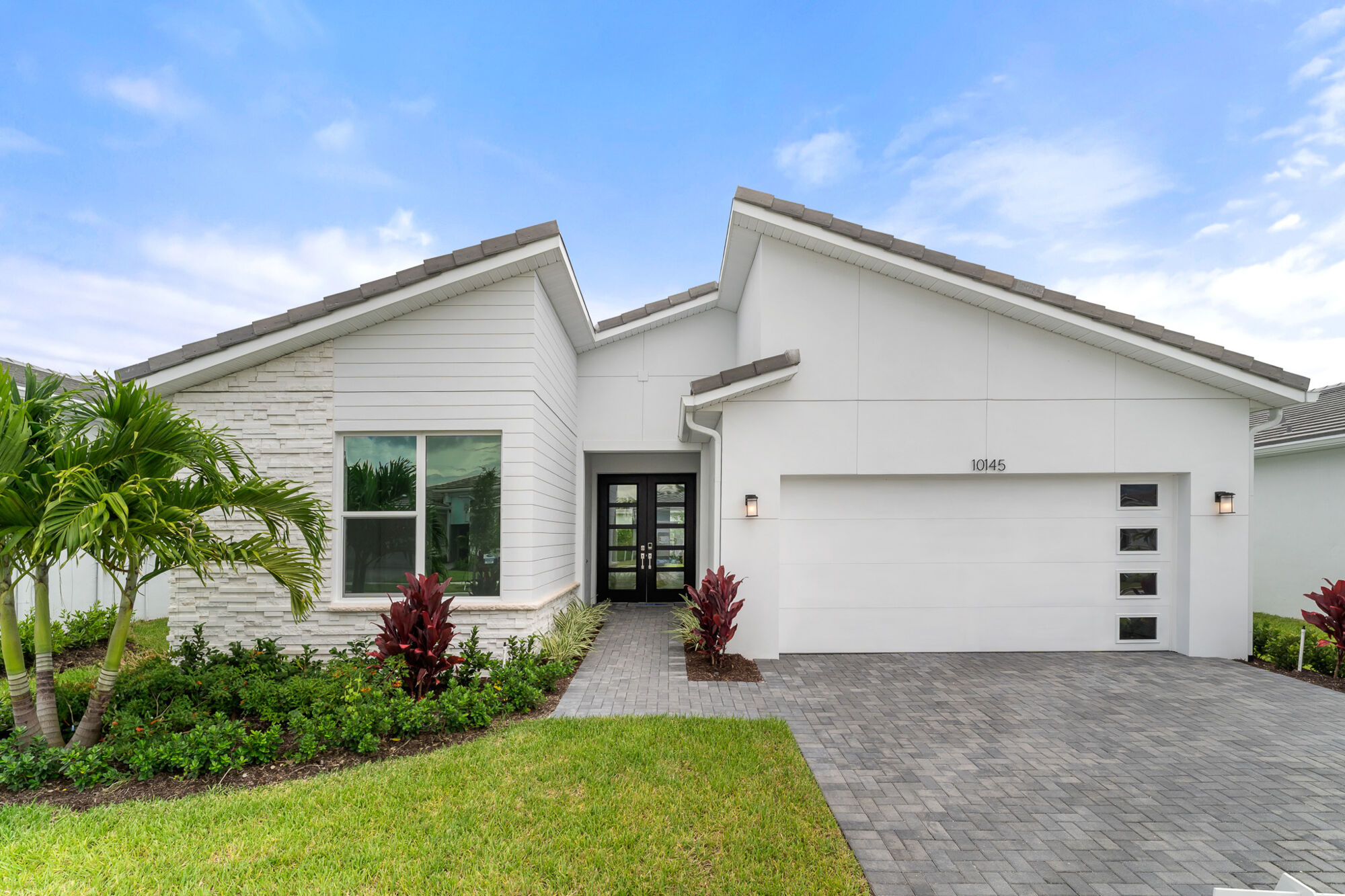  Elevation Front with garage, door, window and exterior clapboard