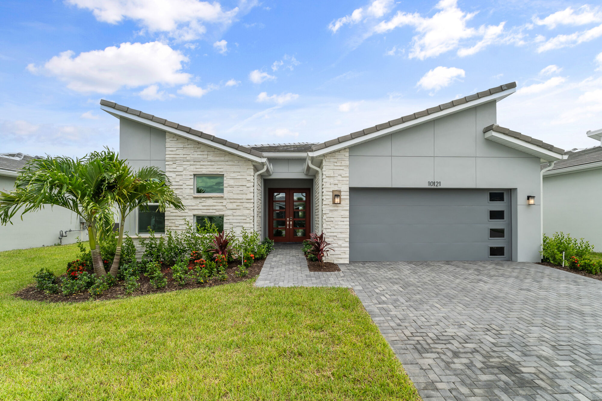  Elevation Front with garage, window, door and exterior stone