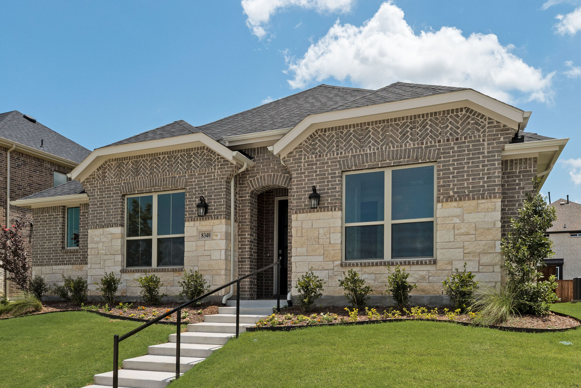Elevation Front with window, exterior stone and exterior brick