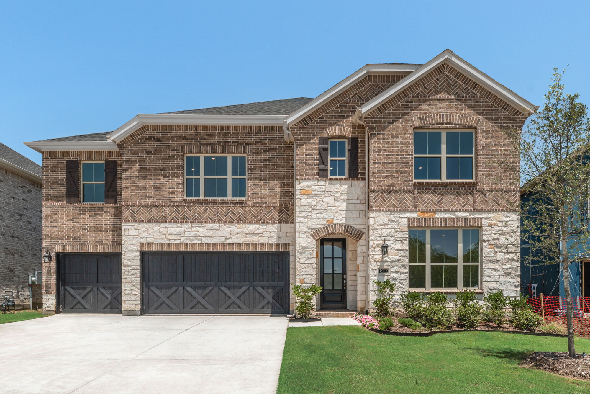 Elevation Front with window, garage, exterior brick, exterior stone and door