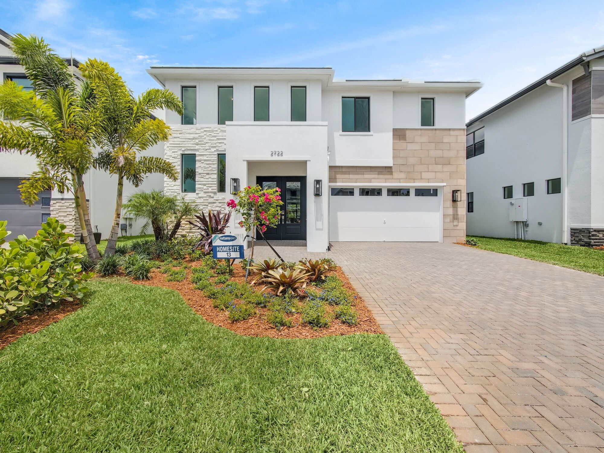 Grand exterior with lush landscaping